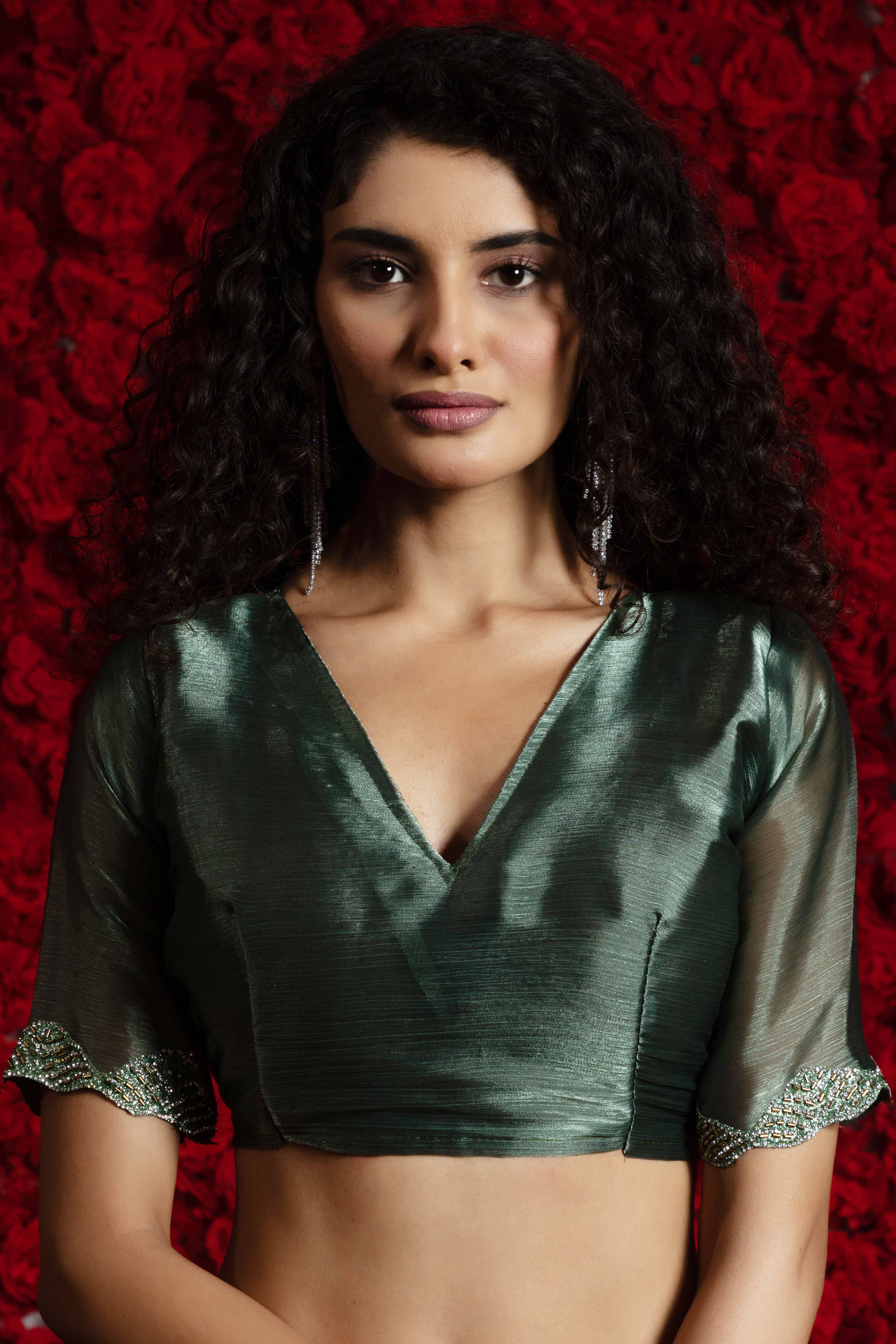 Green Solid Tissue Chiffon Saree Accentuated With A Sparkling Zarkan Work Border