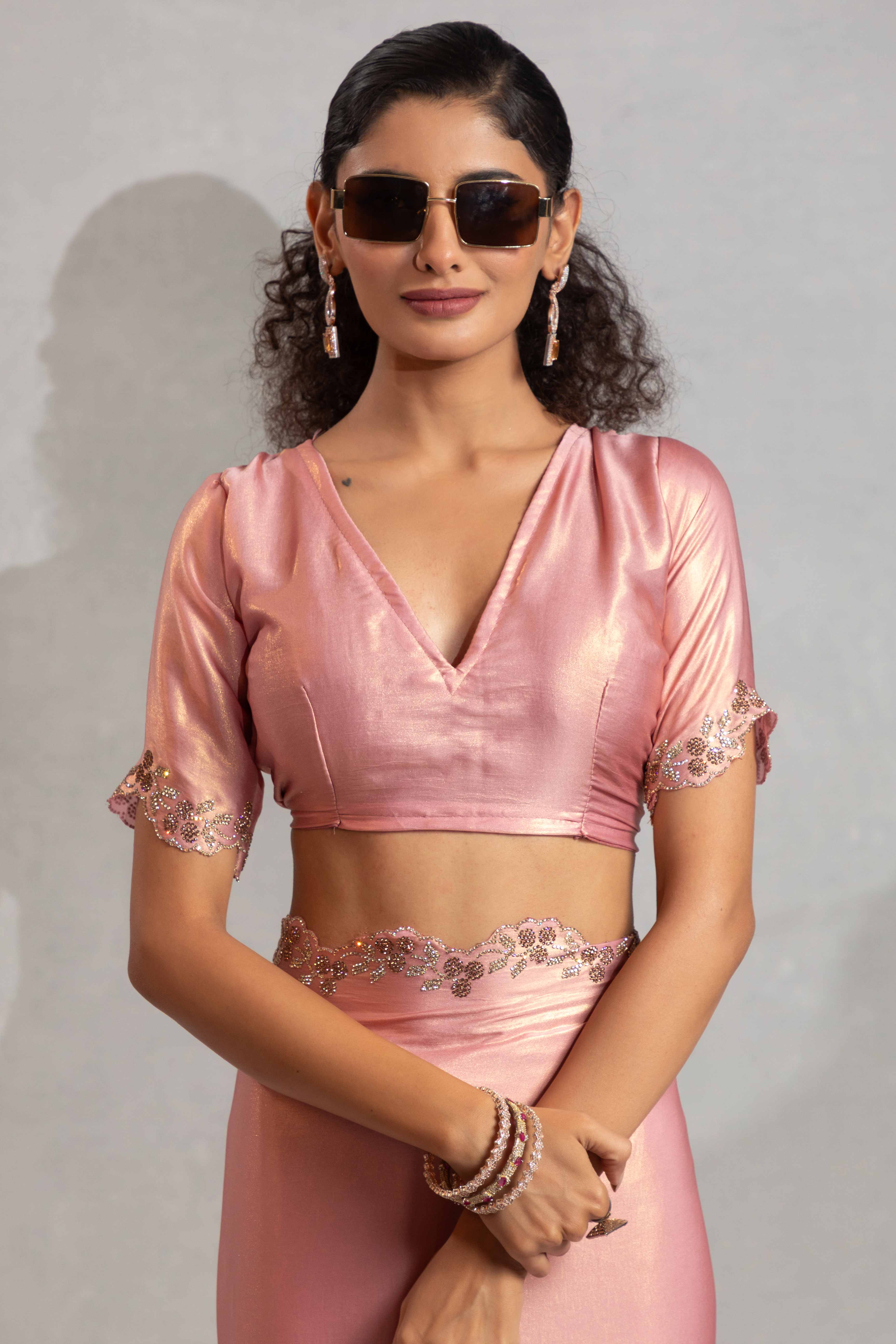 Peach Satin Georgette Saree Adorned With Subtle Foil Finish & A Sparkling Zarkan Work Border