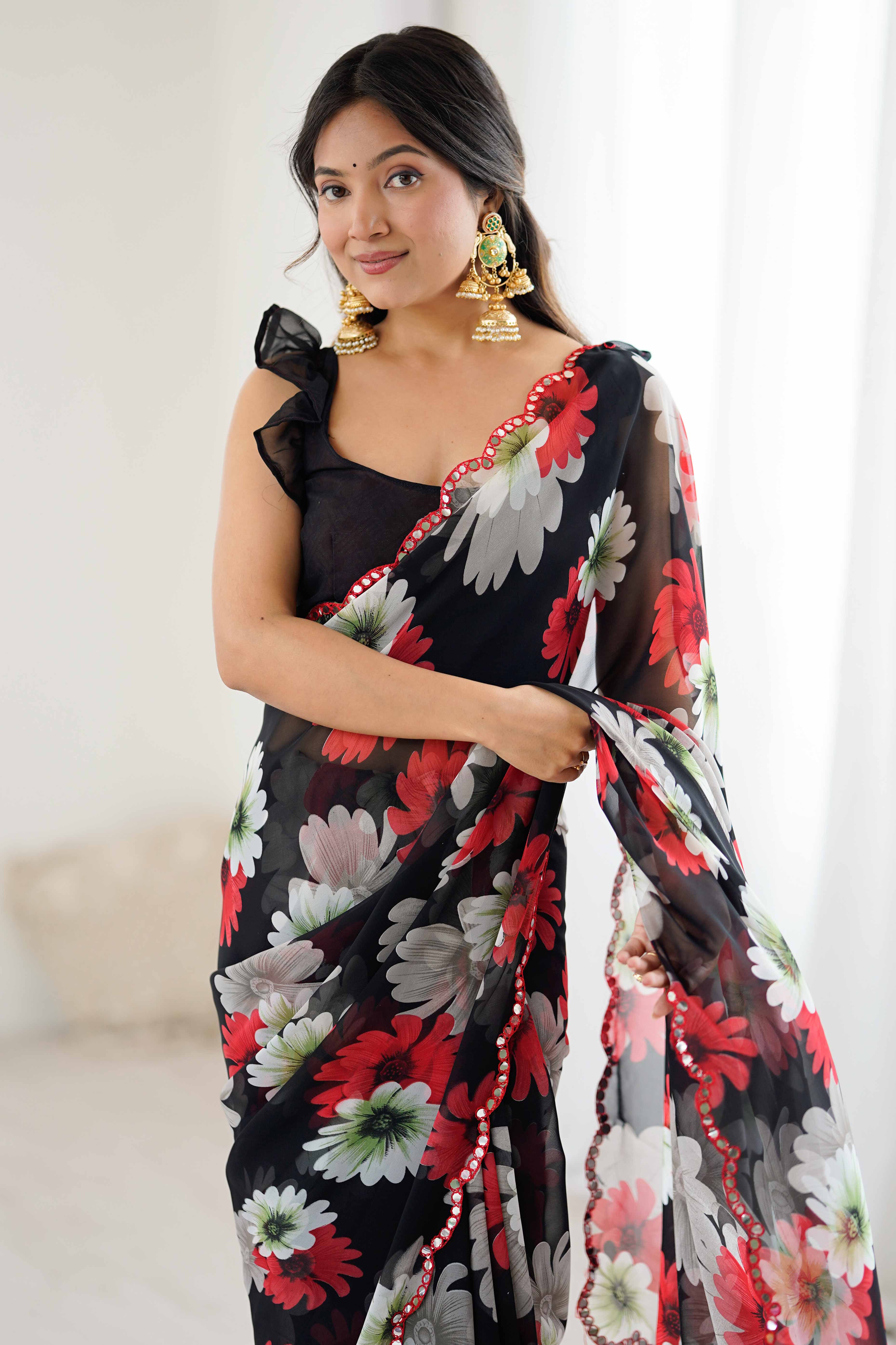 Black Georgette Saree Featuring Floral Prints & Shimmering Mirror Work Border