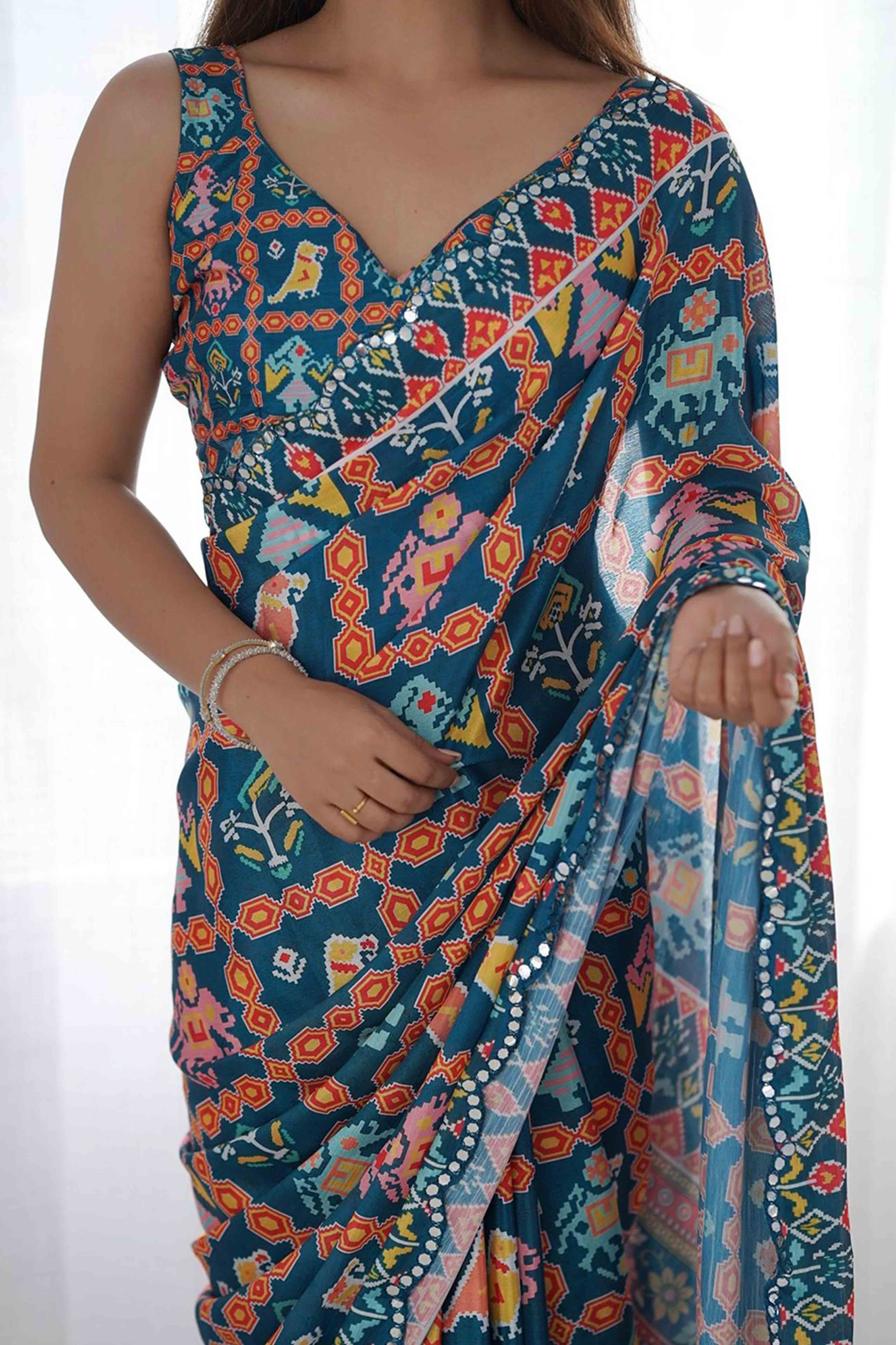 Dark Teal Blue Digital Print Georgette Saree Enhanced With A Sparkling Lace Border