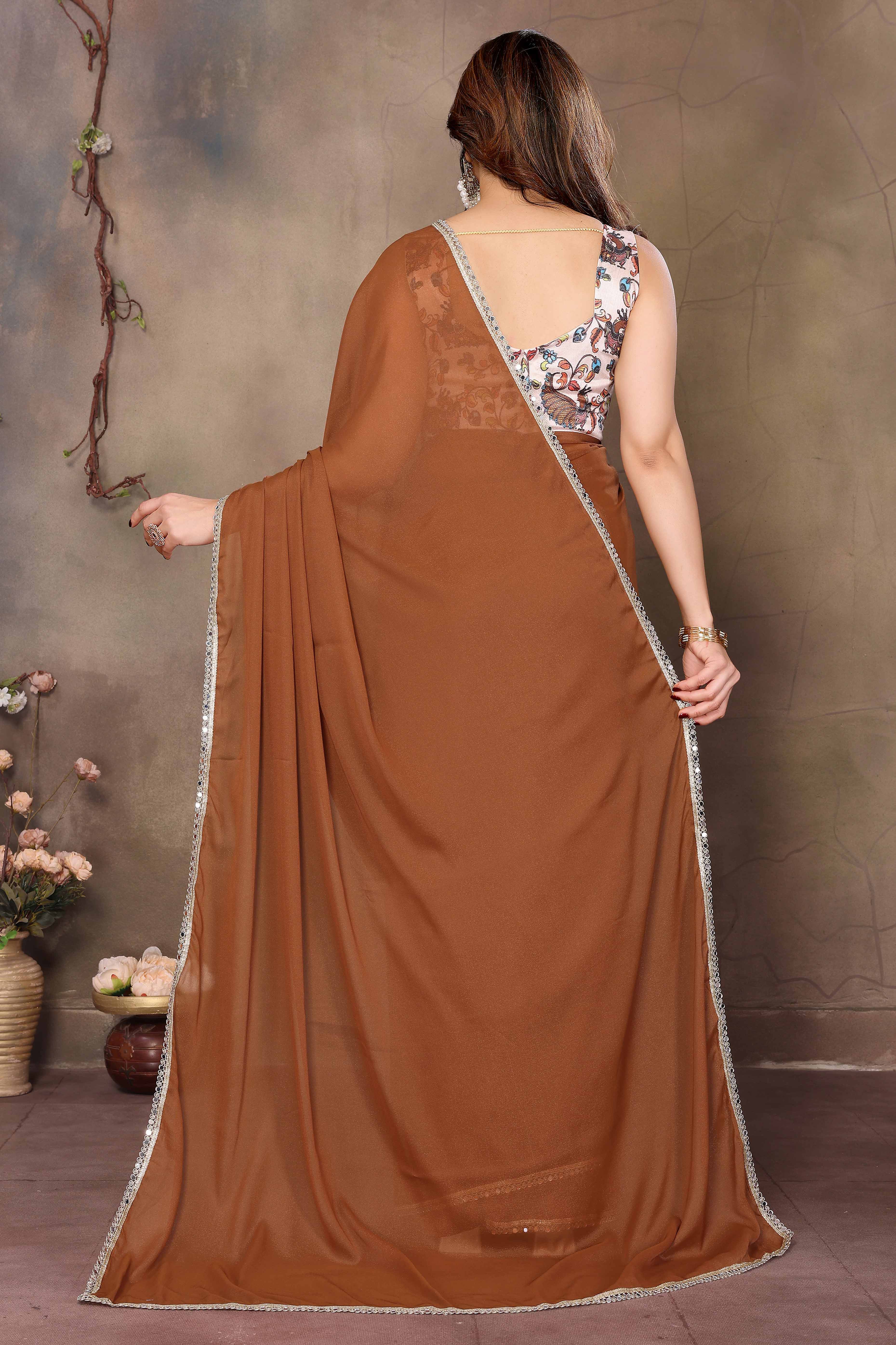 Brown Solid Sparkling Georgette Saree Enhanced With Shimmering Mirror Border