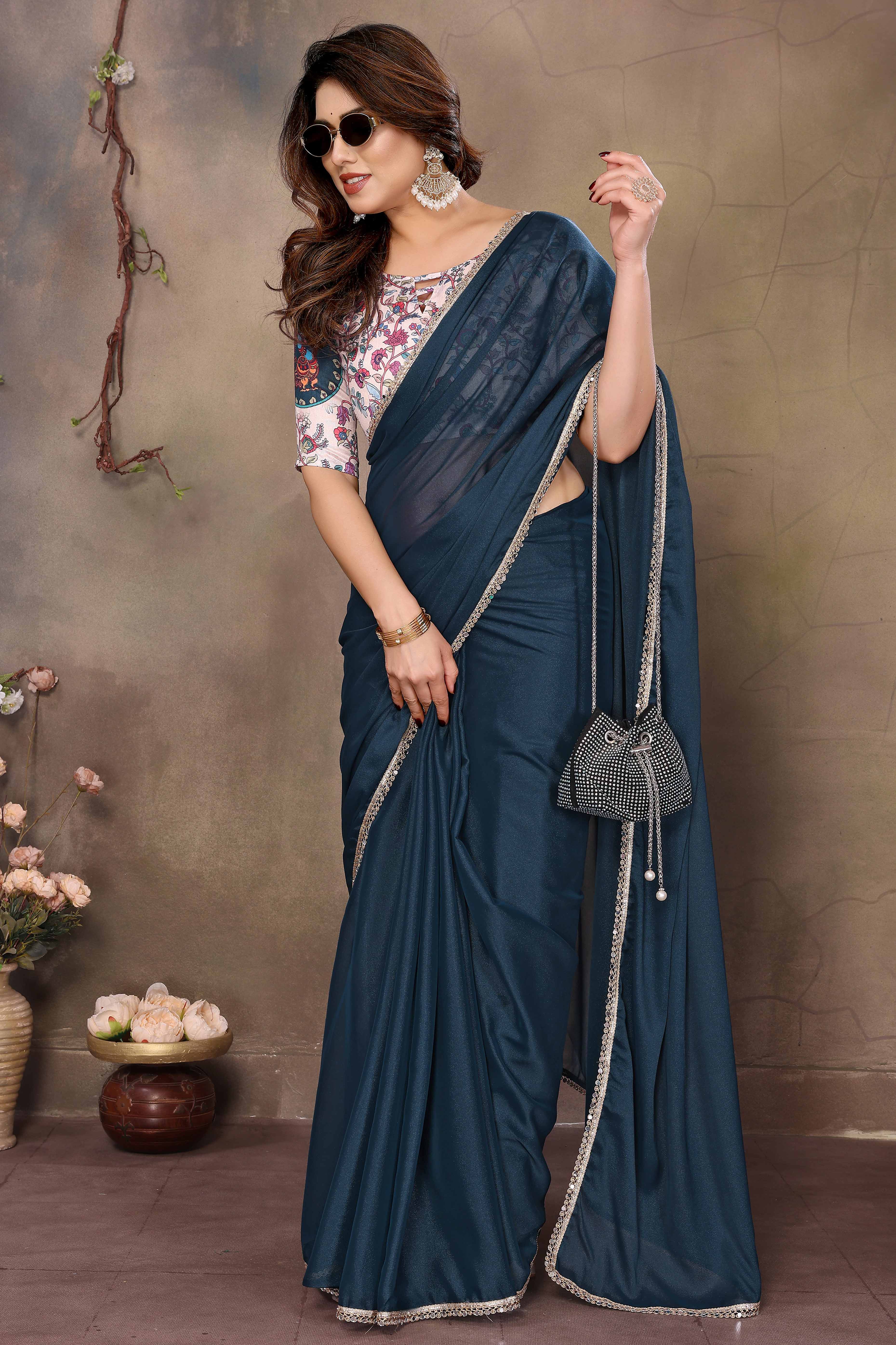 Morpich Blue Solid Sparkling Georgette Saree Enhanced With Shimmering Mirror Border