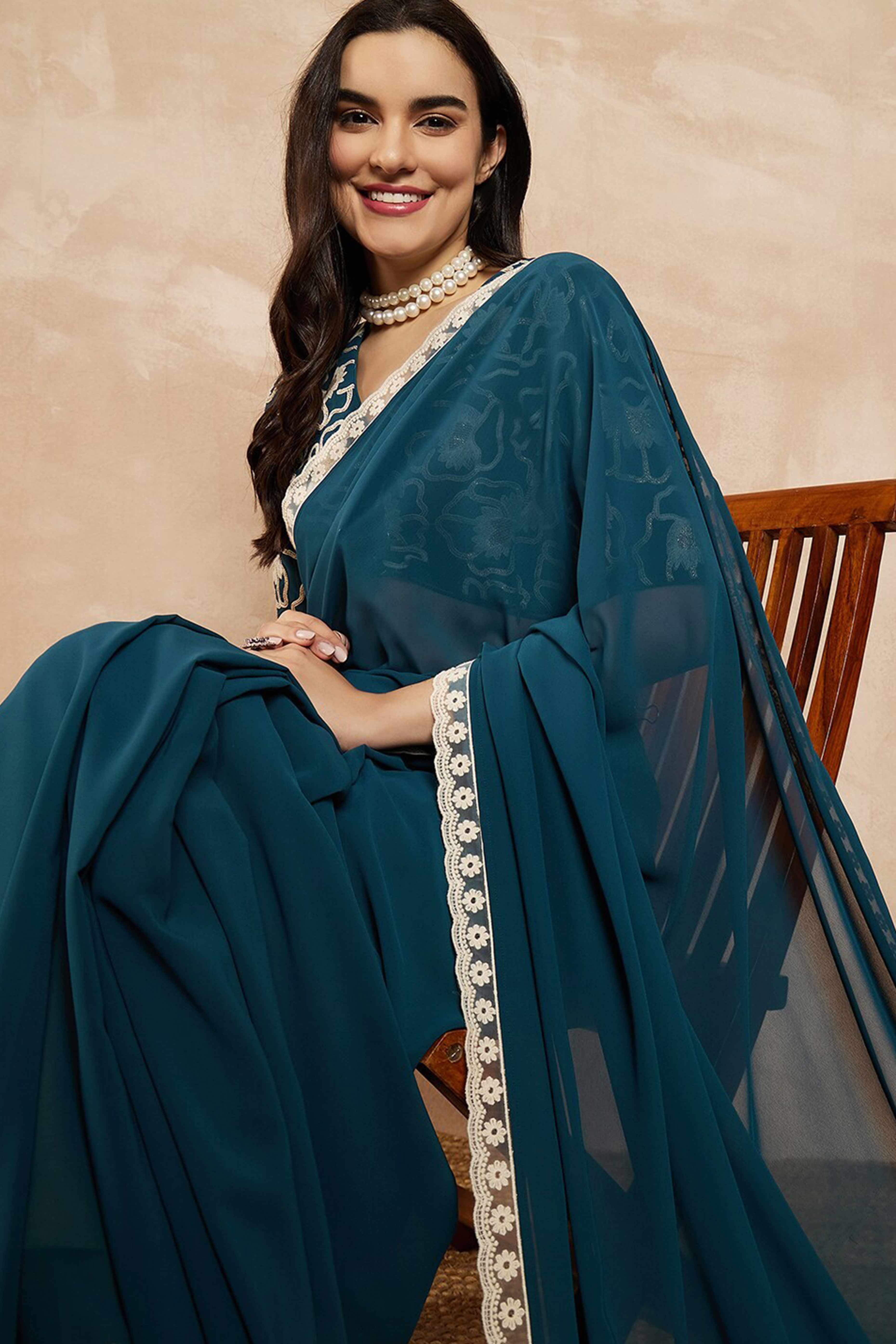 Teal Blue Solid Georgette Saree With Embroidered Border