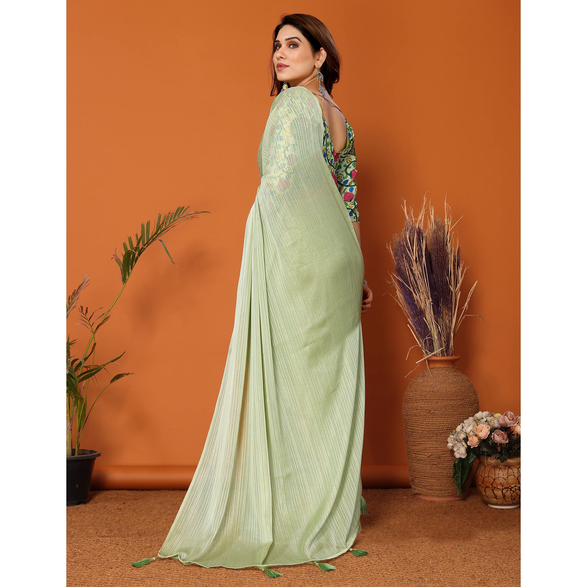 Pista Green Woven Satin Saree With Tassels