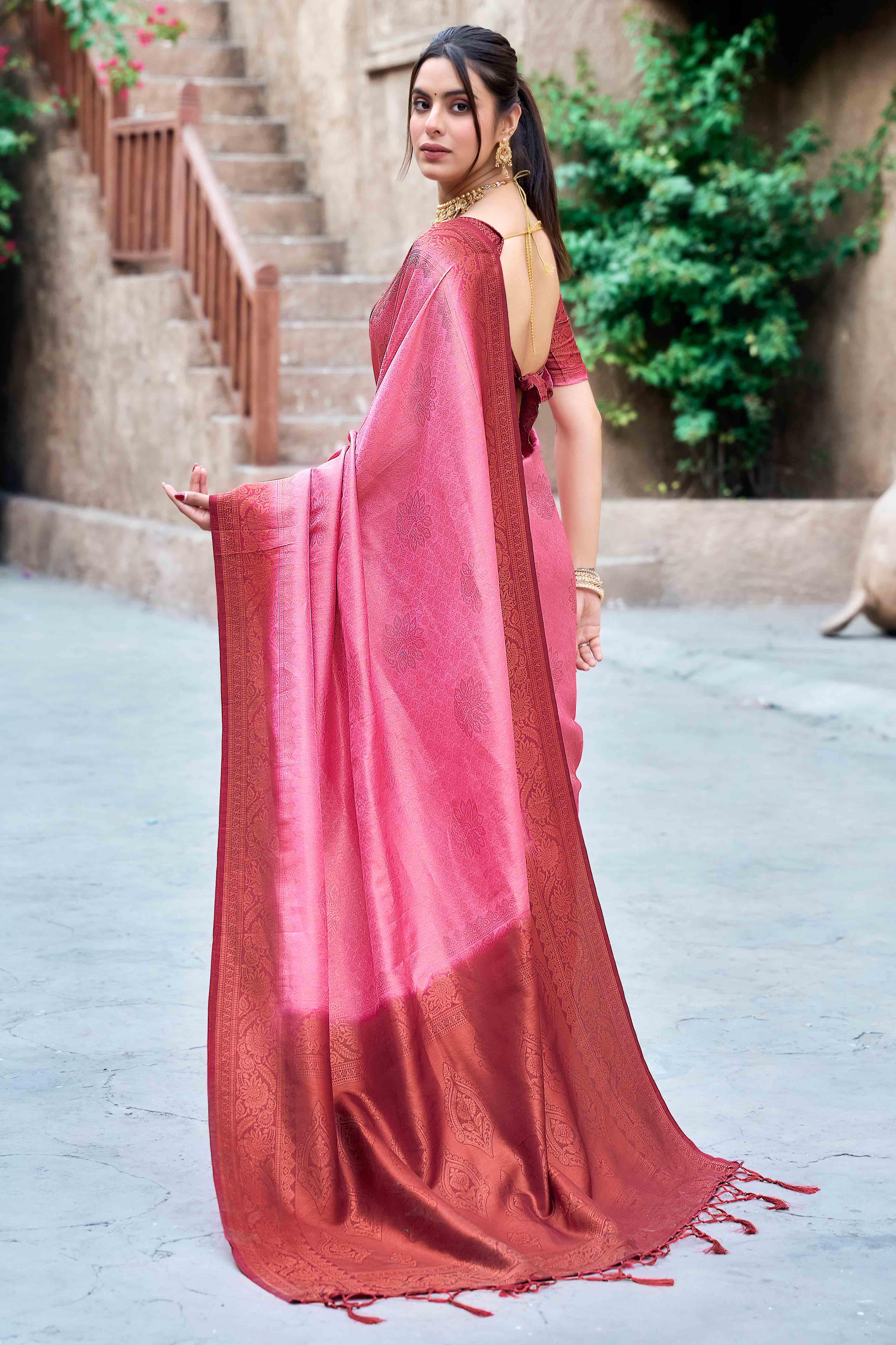 Gajari Pink Banarasi Silk Saree Featuring Elegant Floral Woven & Delicate Tassel Edging