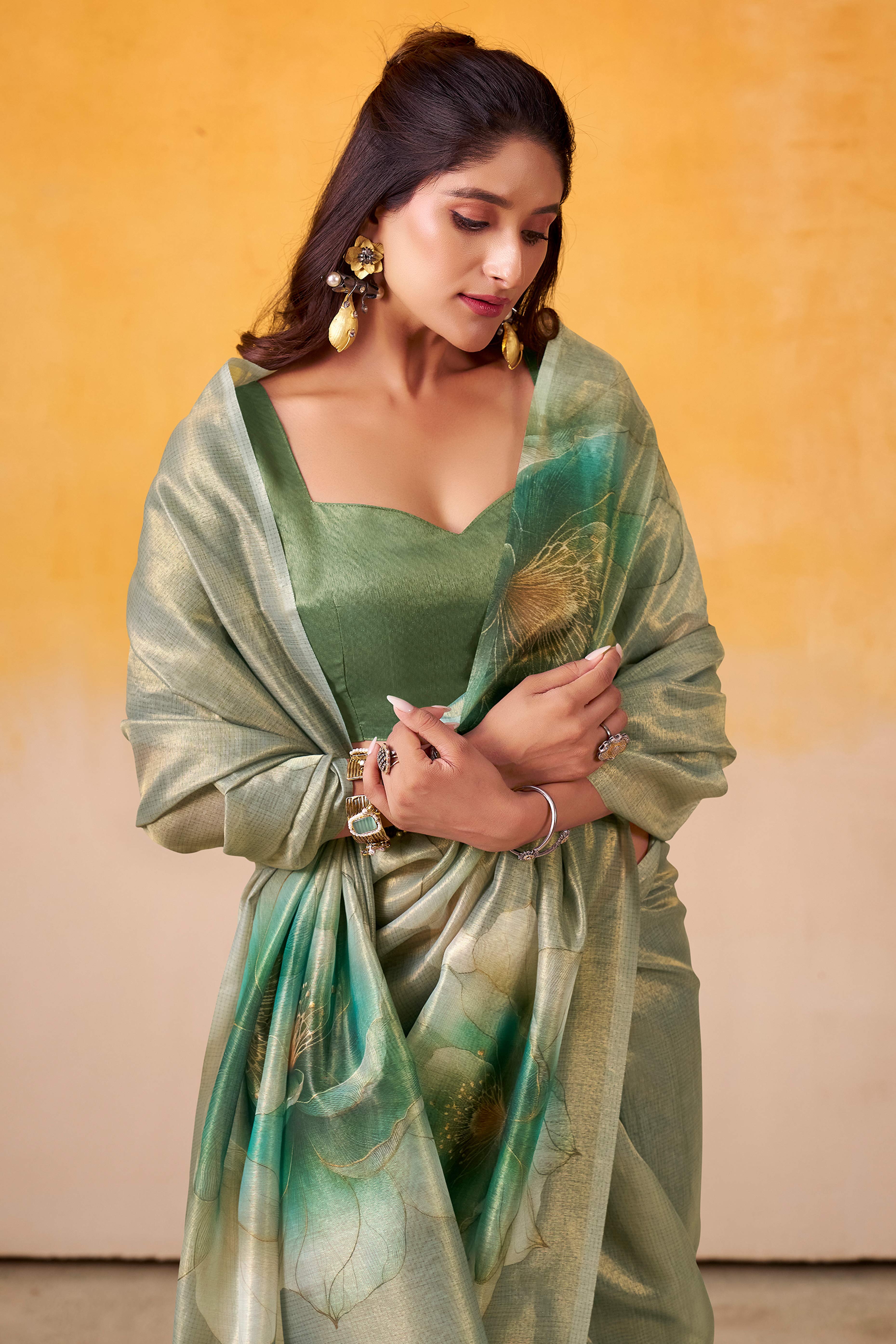 Sophisticated Dusty Green Floral Digital Print Tissue Saree Enhanced With Handmade Tassels