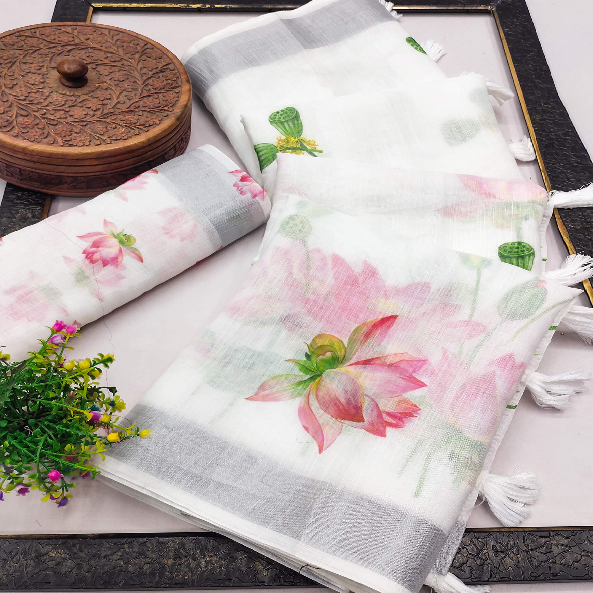 Ethereal White Linen Saree with Floral Print & Tassel Detail