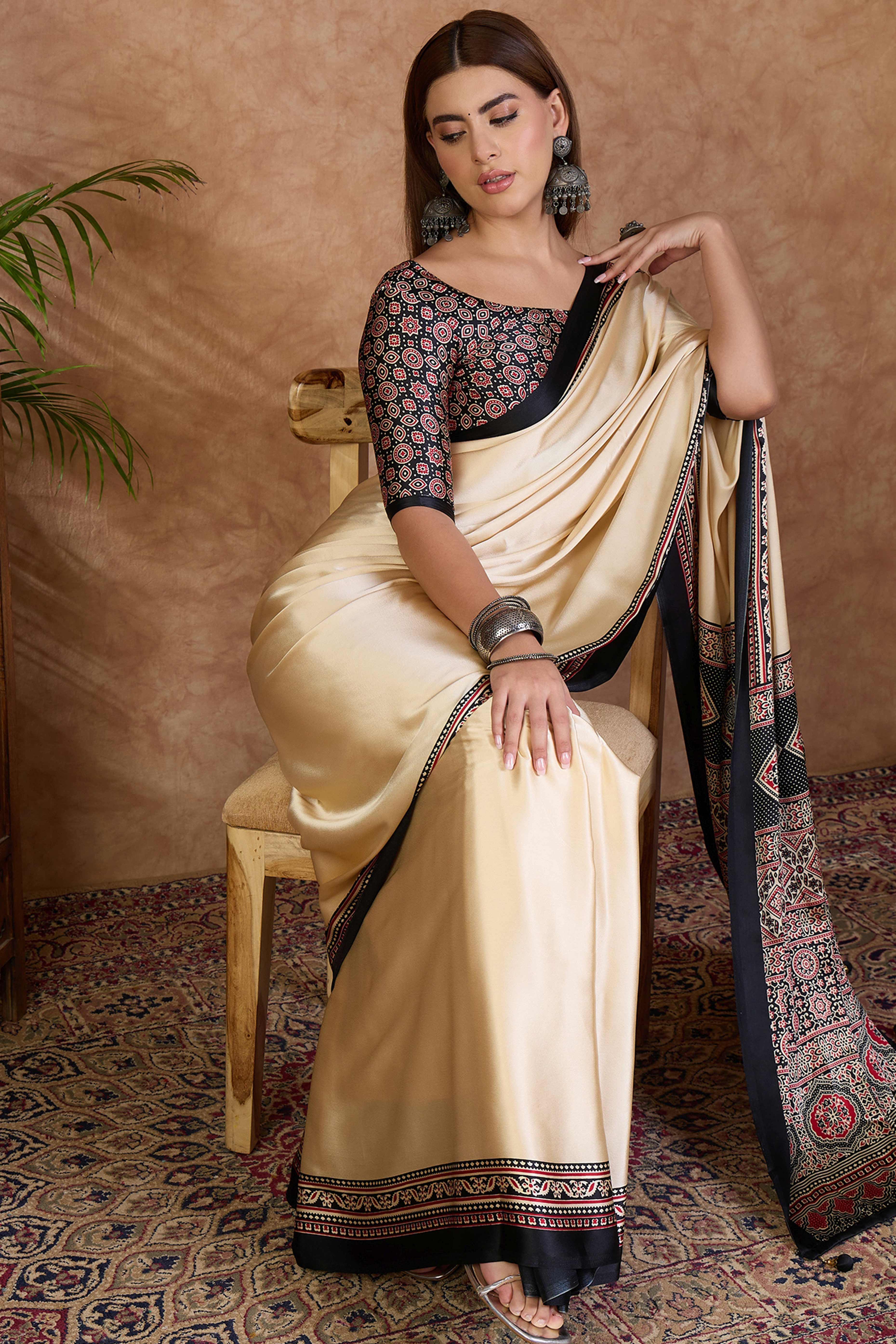Cream & Black Modal Satin Saree Featuring a Solid Base and Artisanal Ajrakh Pallu
