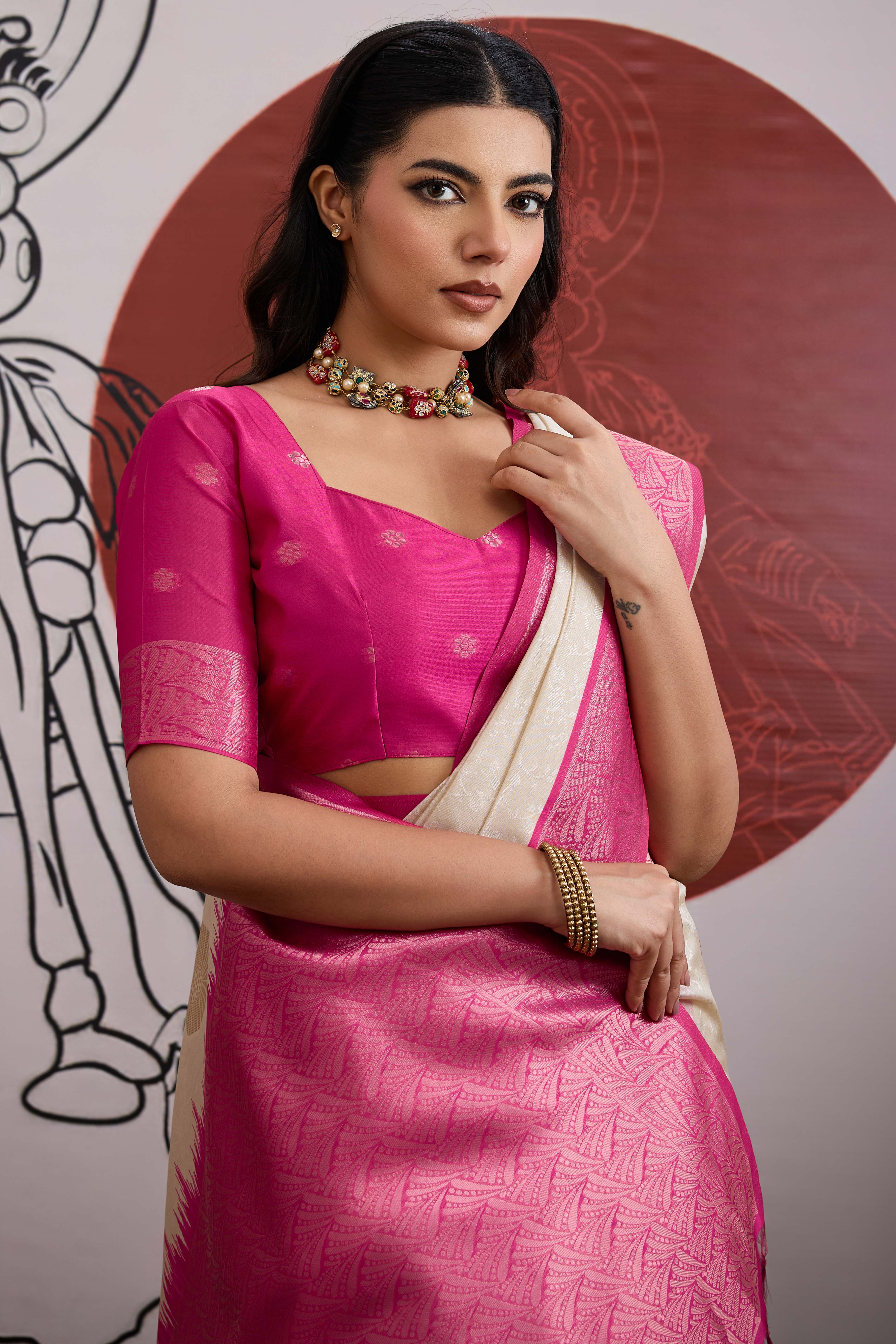 Graceful Cream & Pink Zari Weaving Silk Saree Highlighted By Decorative Tassel Pallu