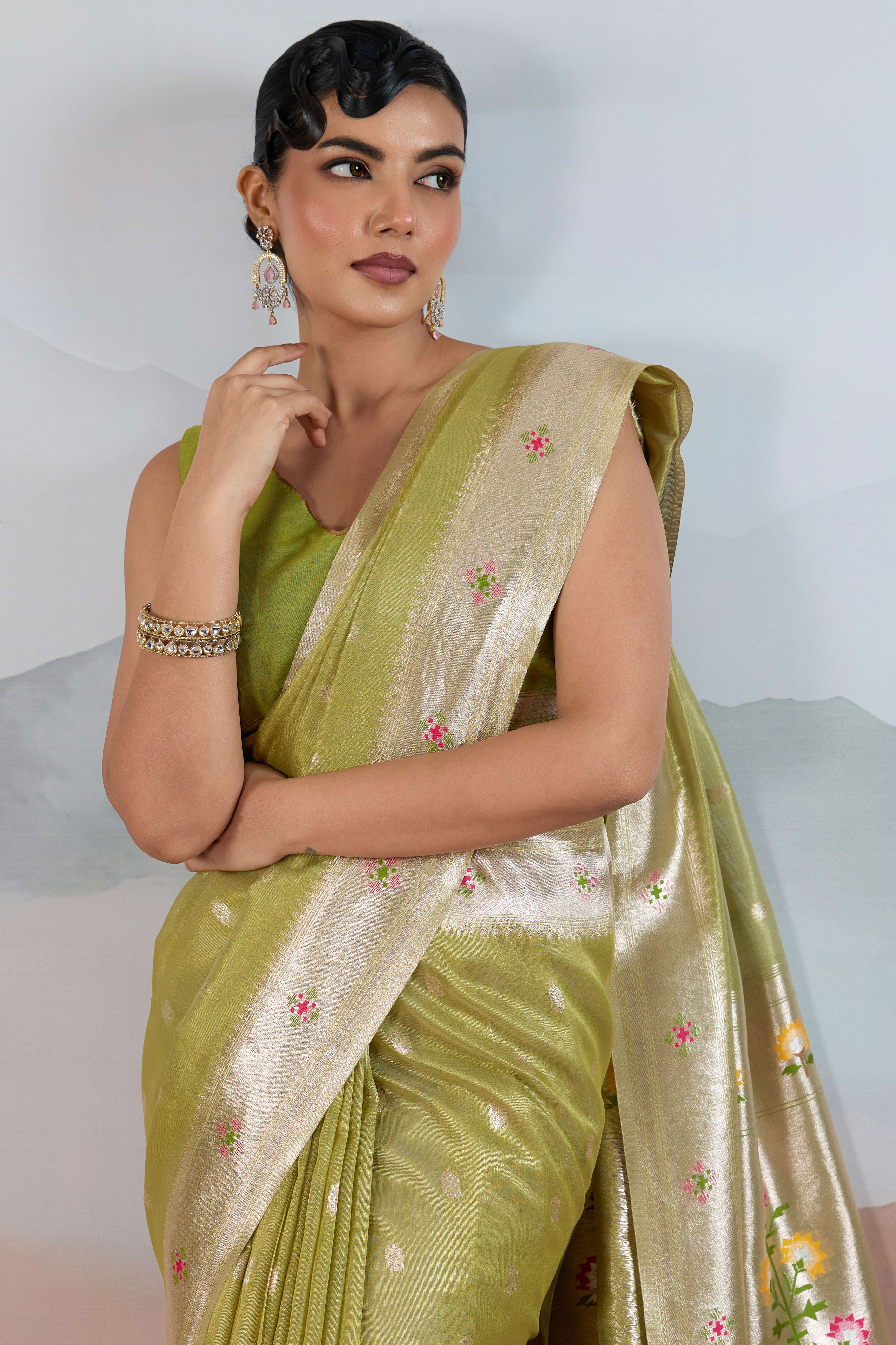 Green Festive Tissue Saree Crafted with Artistic Zari Butti Weaving and a Featherlight Texture