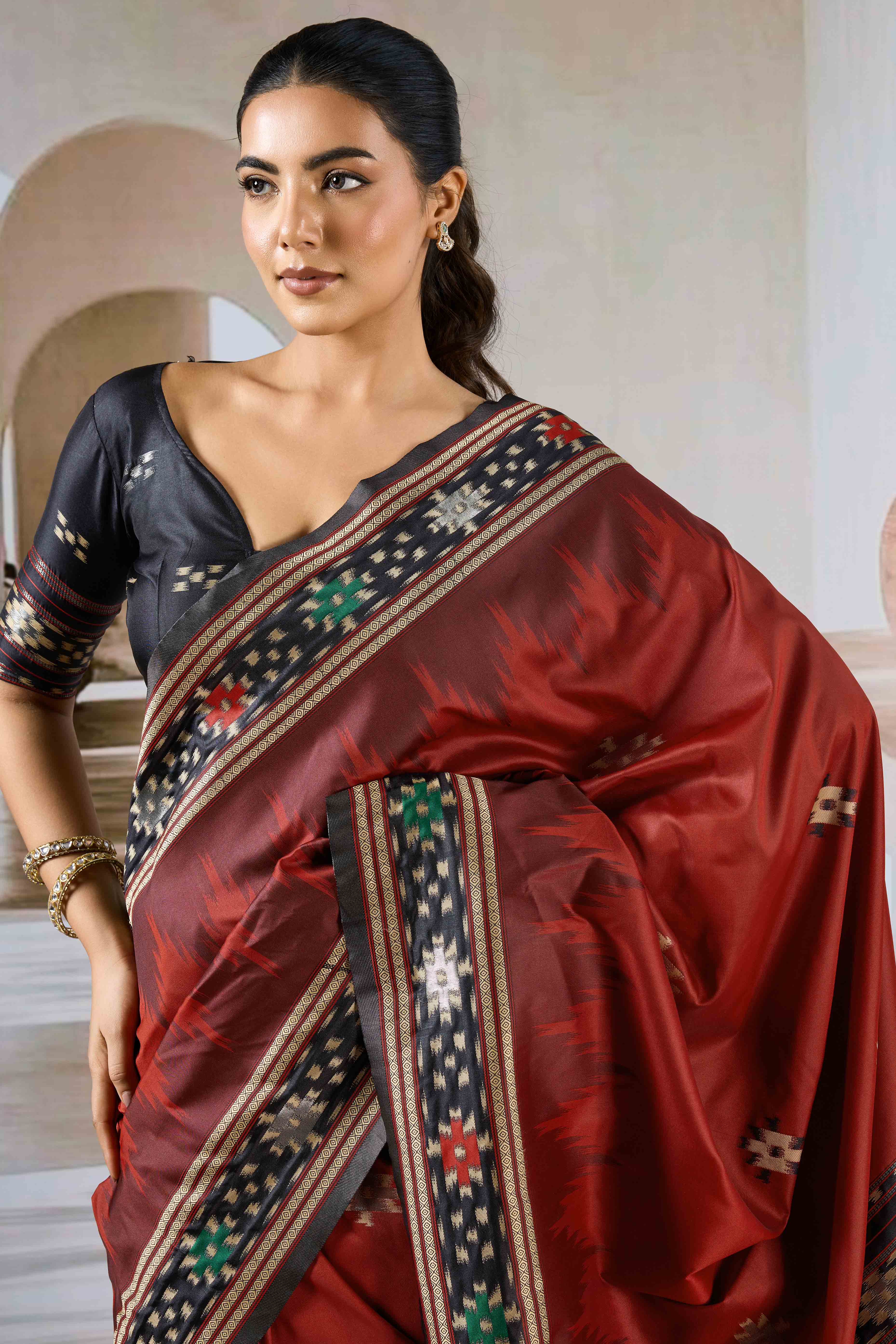 Maroon Art Silk Saree Adorned with Intricate Patola Style Woven Designs