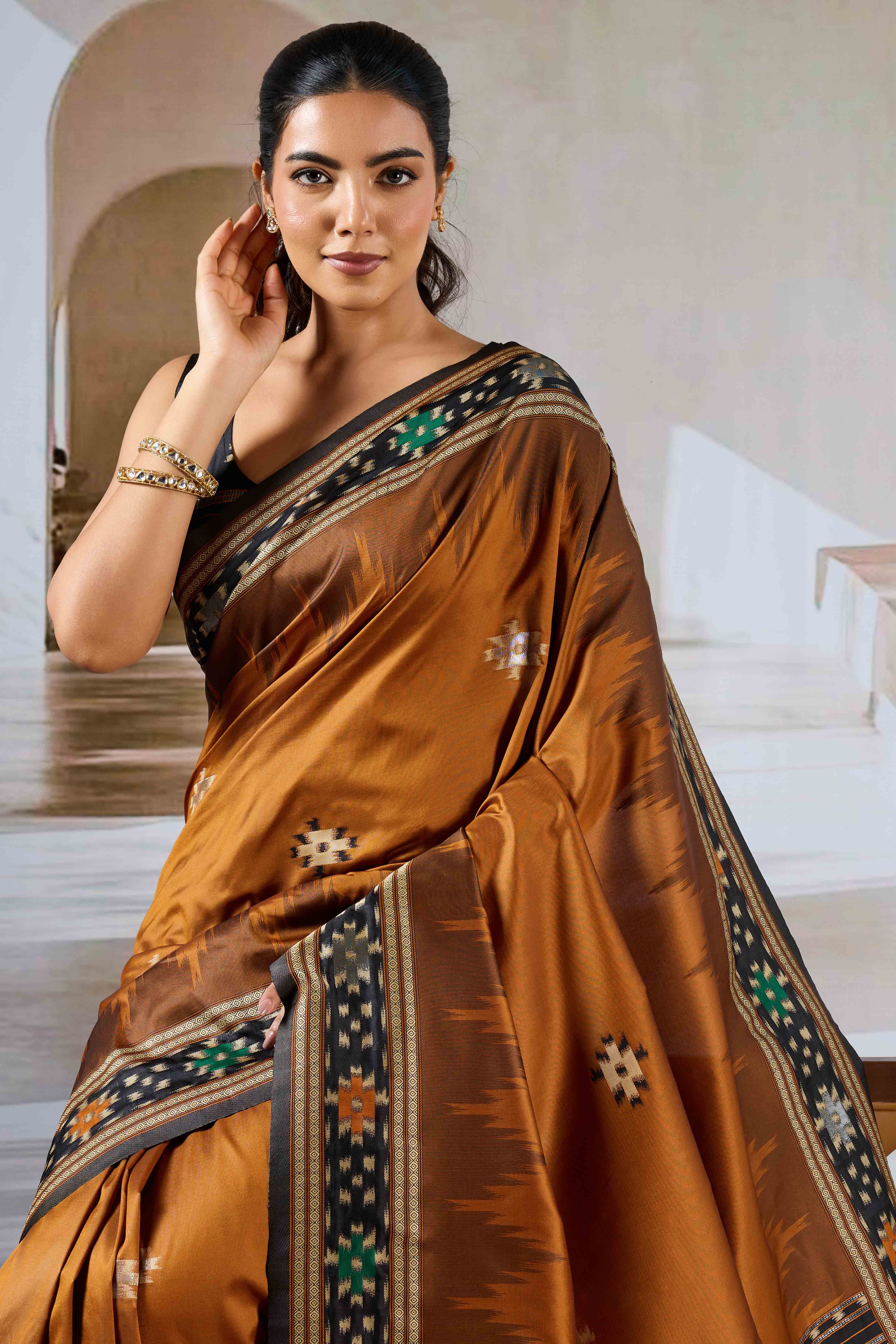 Brown Art Silk Saree Adorned with Intricate Patola Style Woven Designs