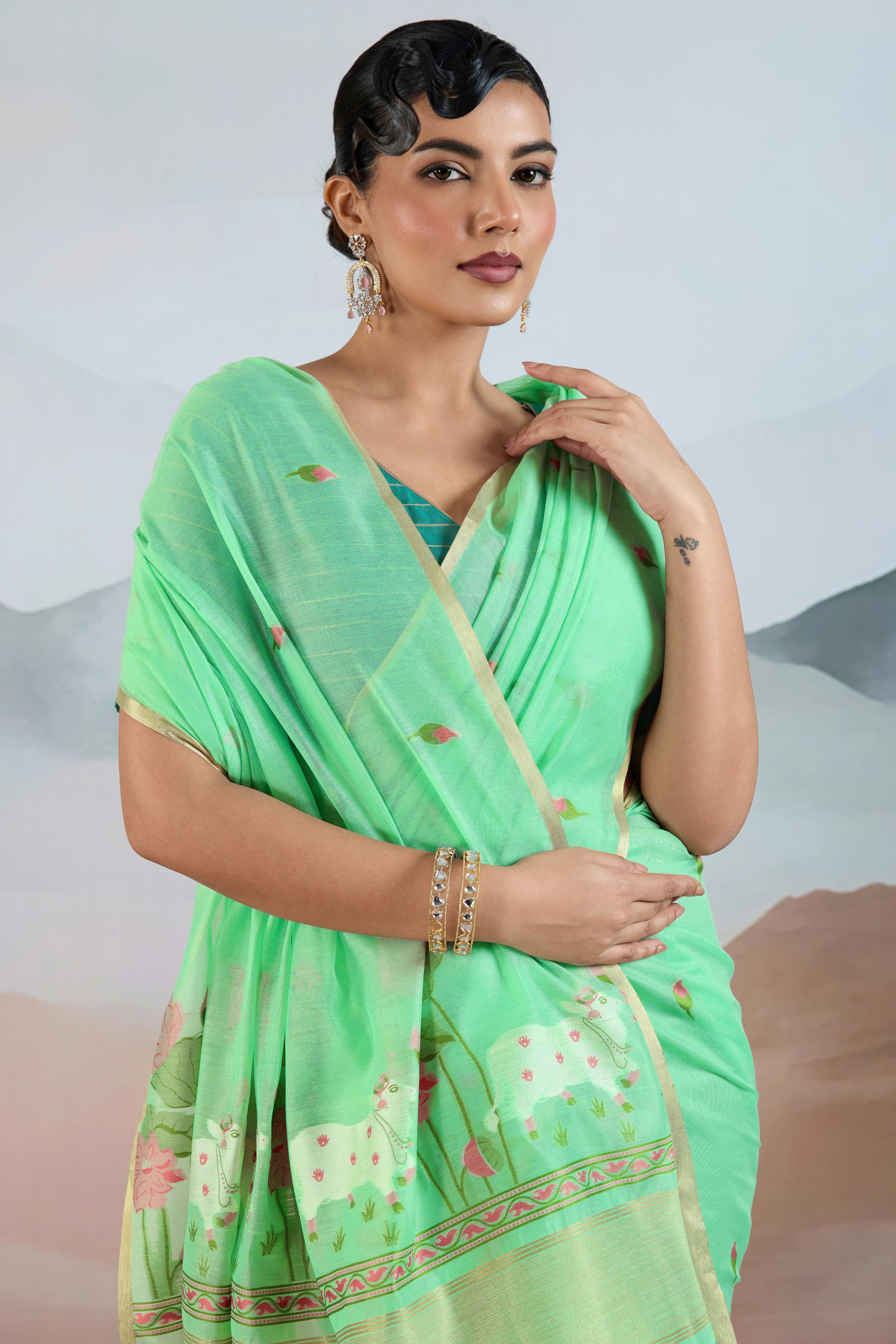 Trendy Sea Green Cotton Blend Weaving Saree Showcasing Floral & Animal Motif & Classic Tassel Pallu