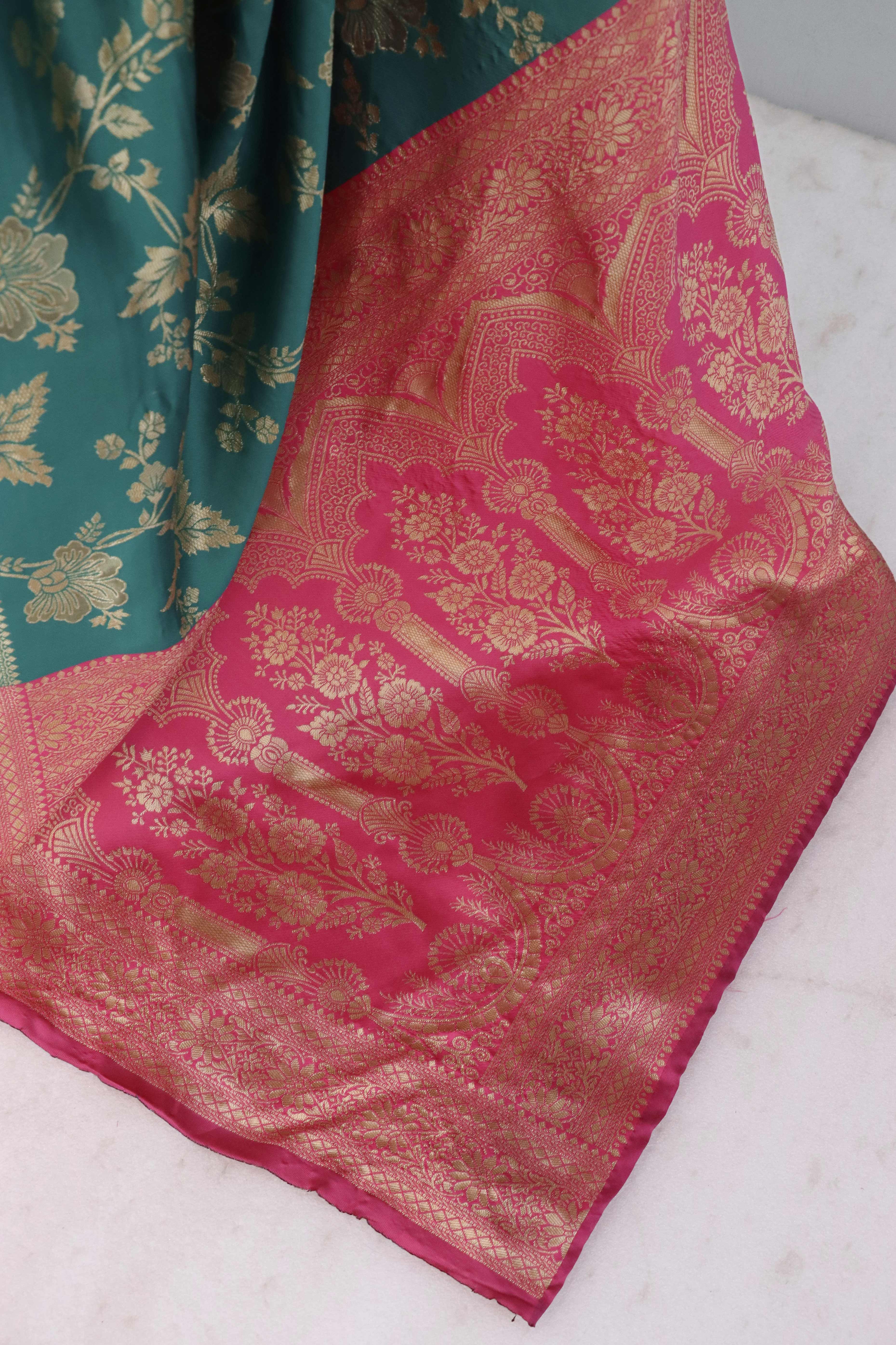 Graceful Rama Blue & Pink Banarasi Silk Saree Featuring Intricate Floral Zari Weaving Work