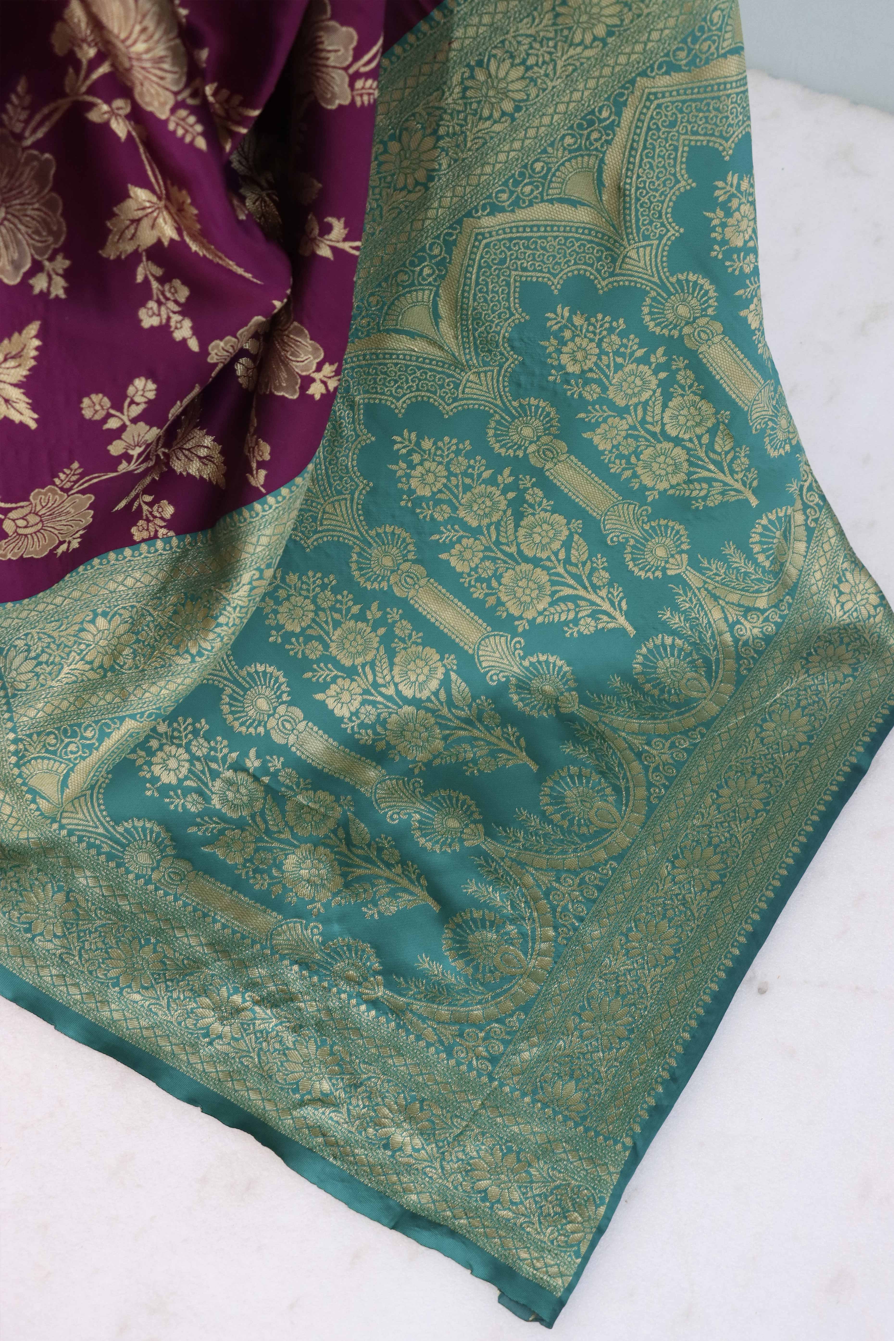 Graceful Wine & Rama Banarasi Silk Saree Featuring Intricate Floral Zari Weaving Work