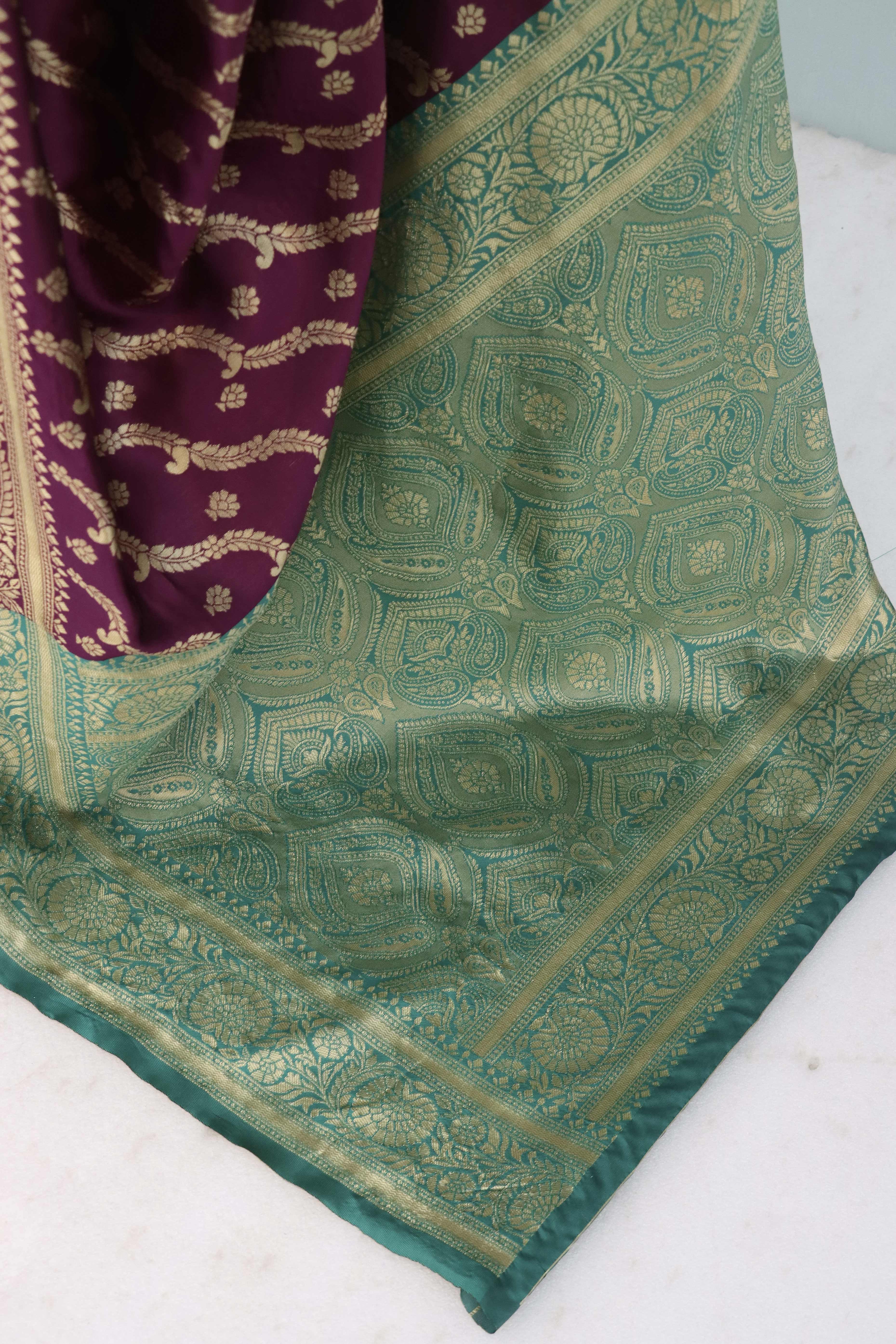 Graceful Wine Banarasi Silk Saree Featuring Intricate Floral Zari Weaving Work