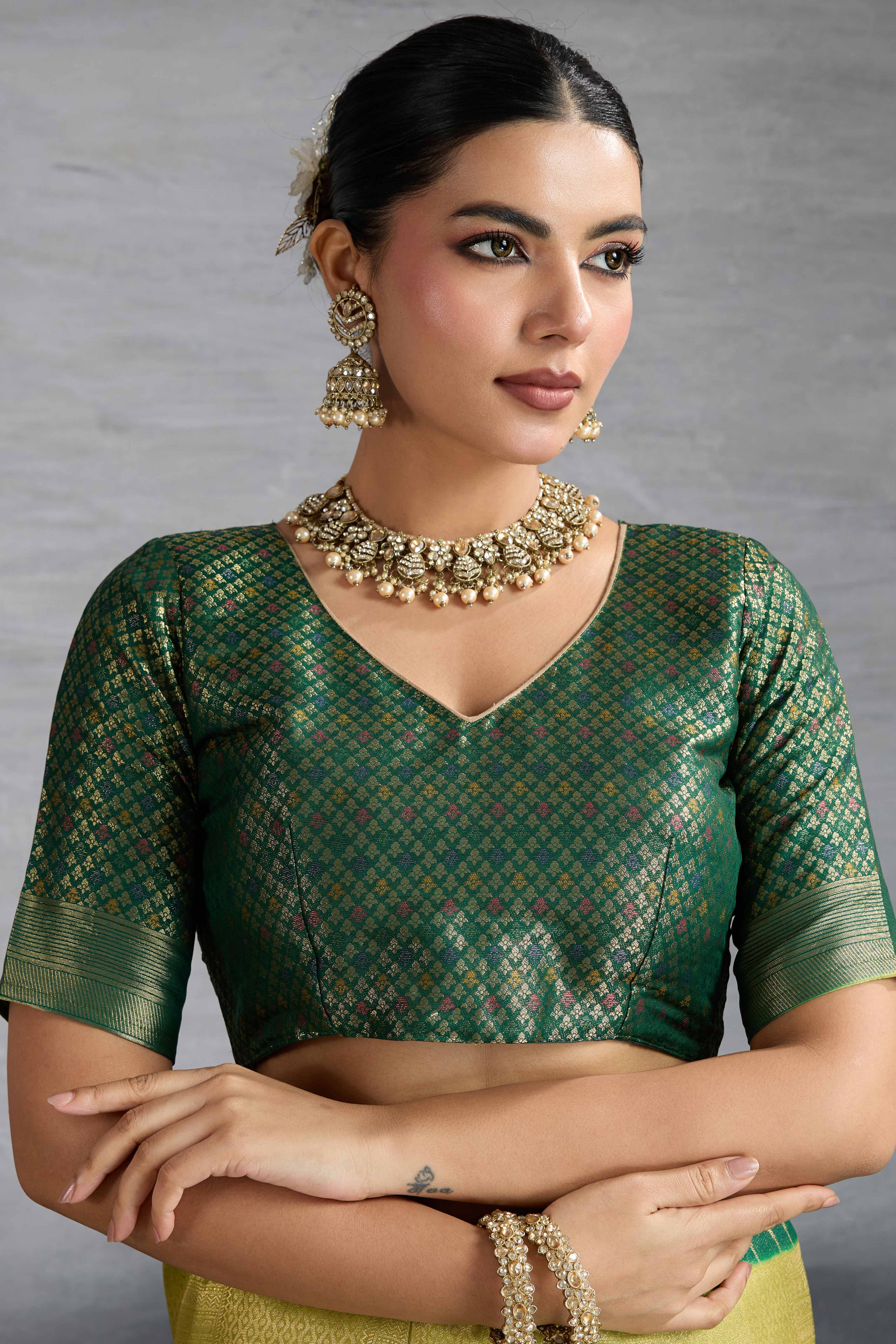 Green Silk Kanjivaram Saree Enhanced With Kadiyal Weaving Borders