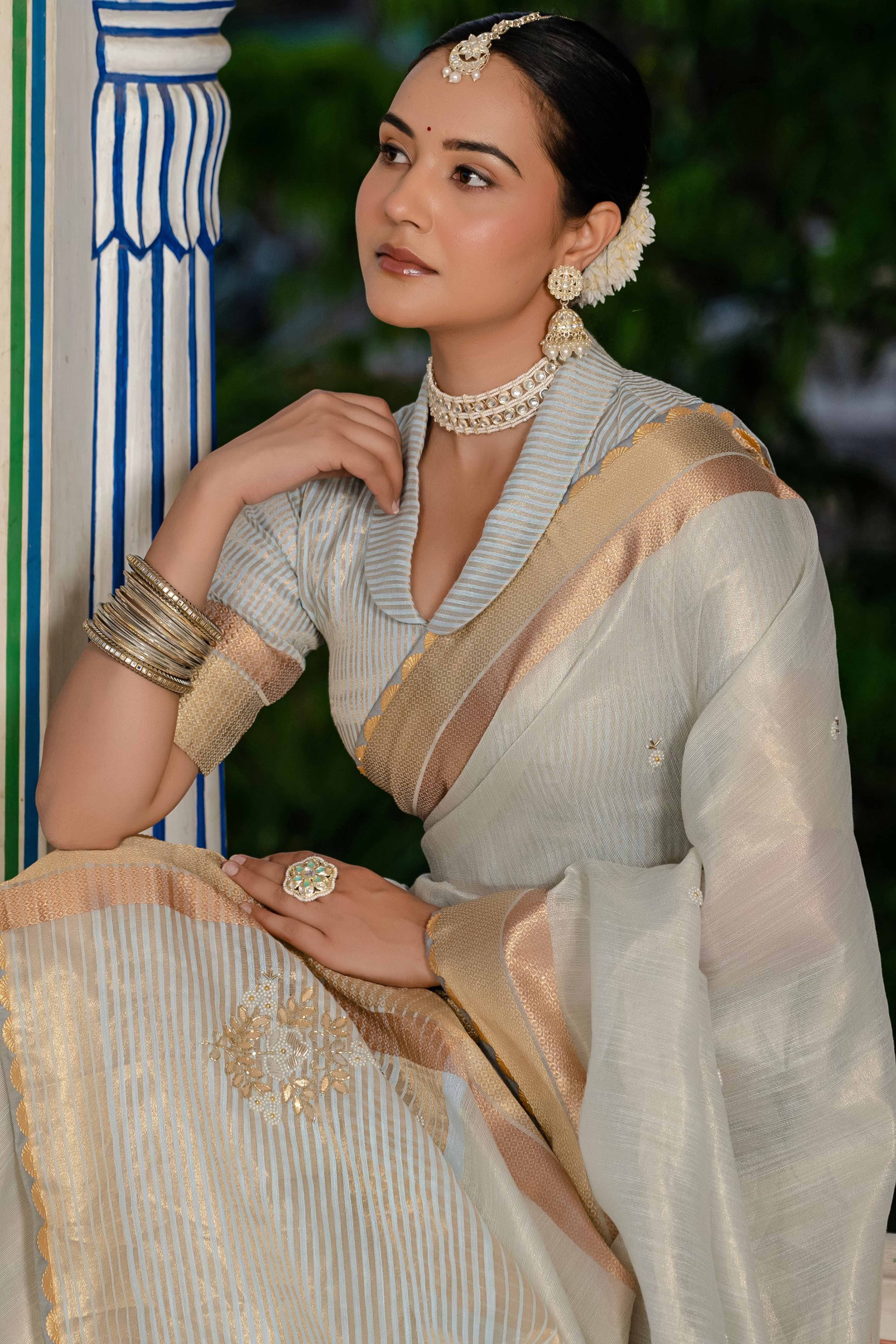 Sky Blue Tissue Linen Saree Featuring Intricate Zari and Beadwork