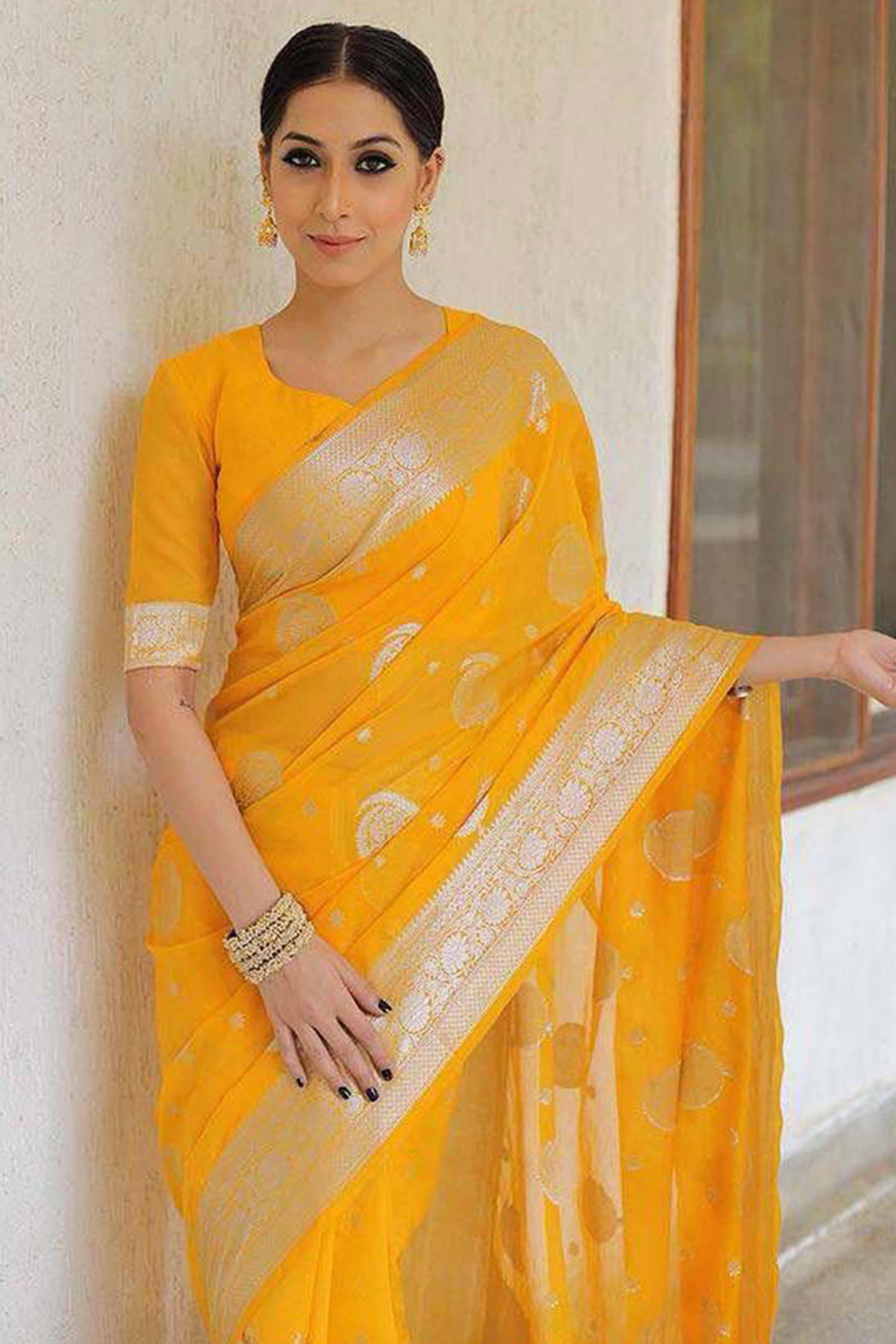Vibrant Yellow Floral Zari Woven Lichi Banarasi Silk Saree With Rich Detailing