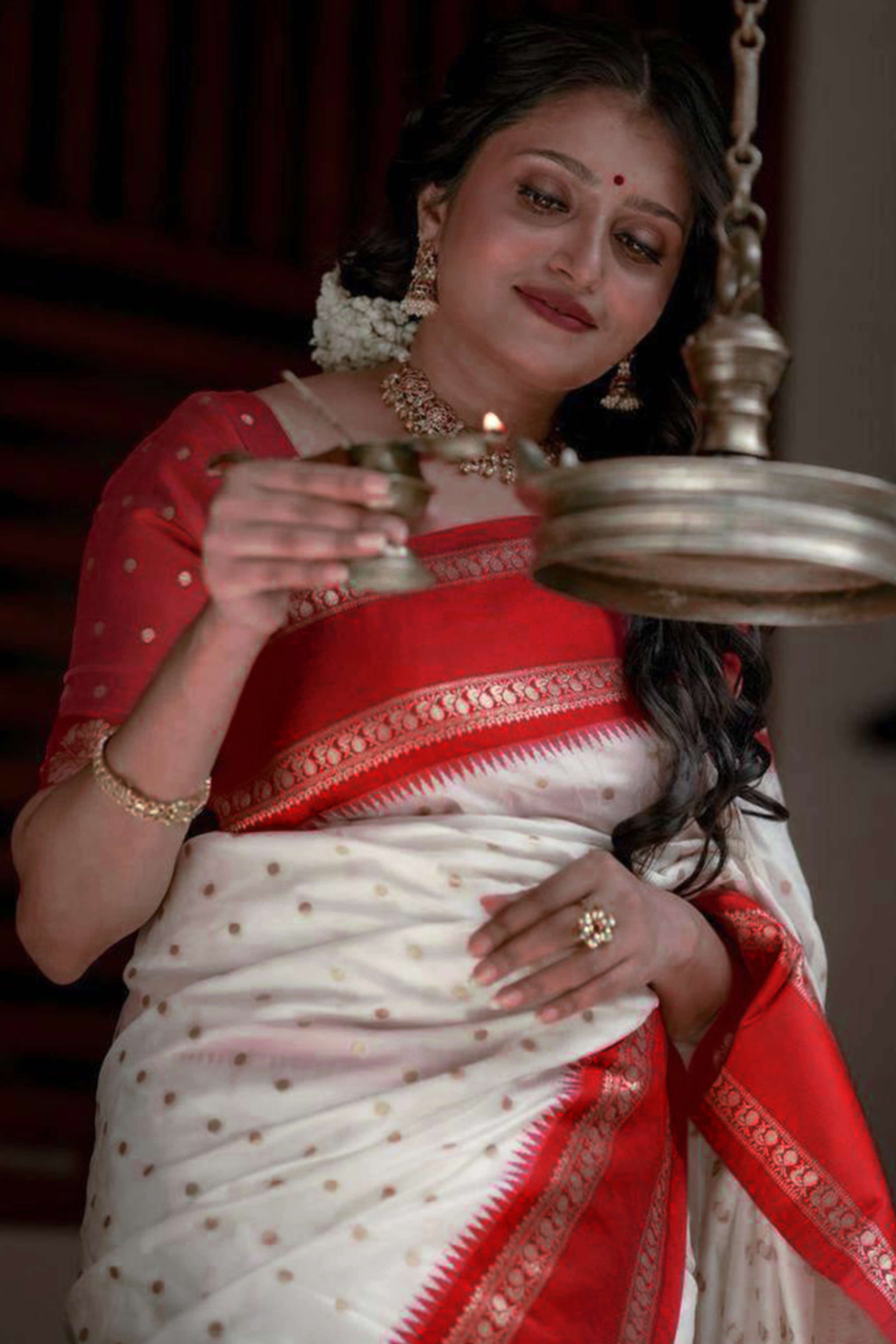 Graceful White & Red Zari Woven Lichi Banarasi Silk Saree With Tassel Accents