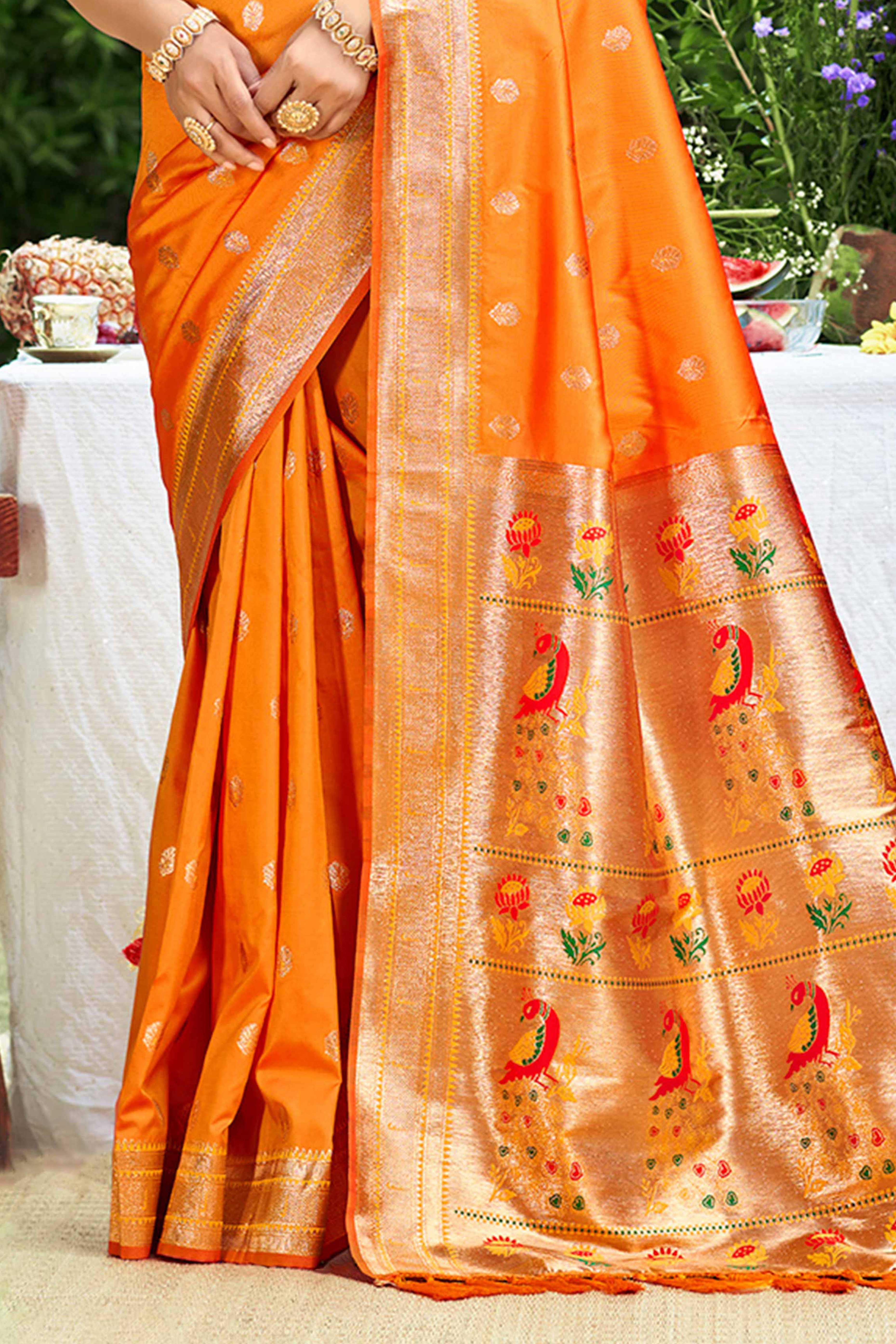 Orange Zari Weaving Silk Blend Saree Adorned With Intricate Peacock Motif Pallu & Graceful Tassel
