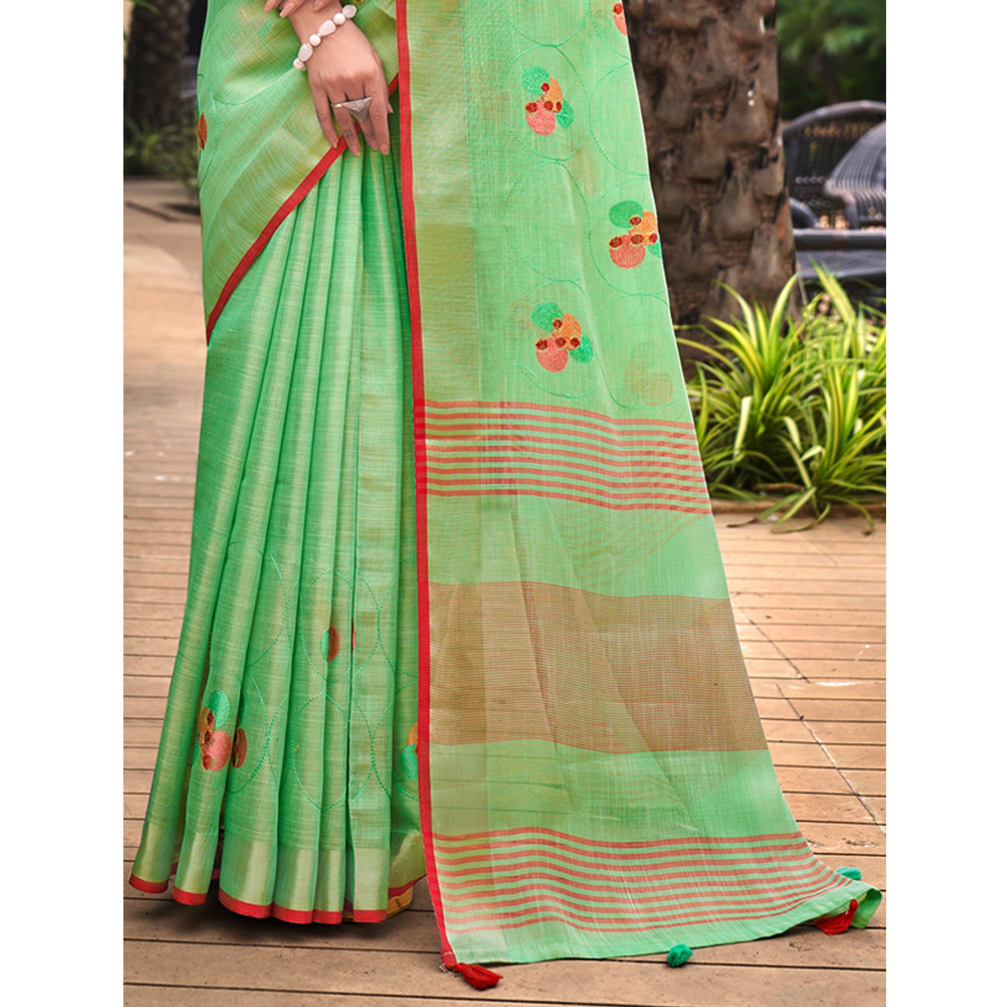 Sea Green Floral Embroidered Linen Saree With Tassels