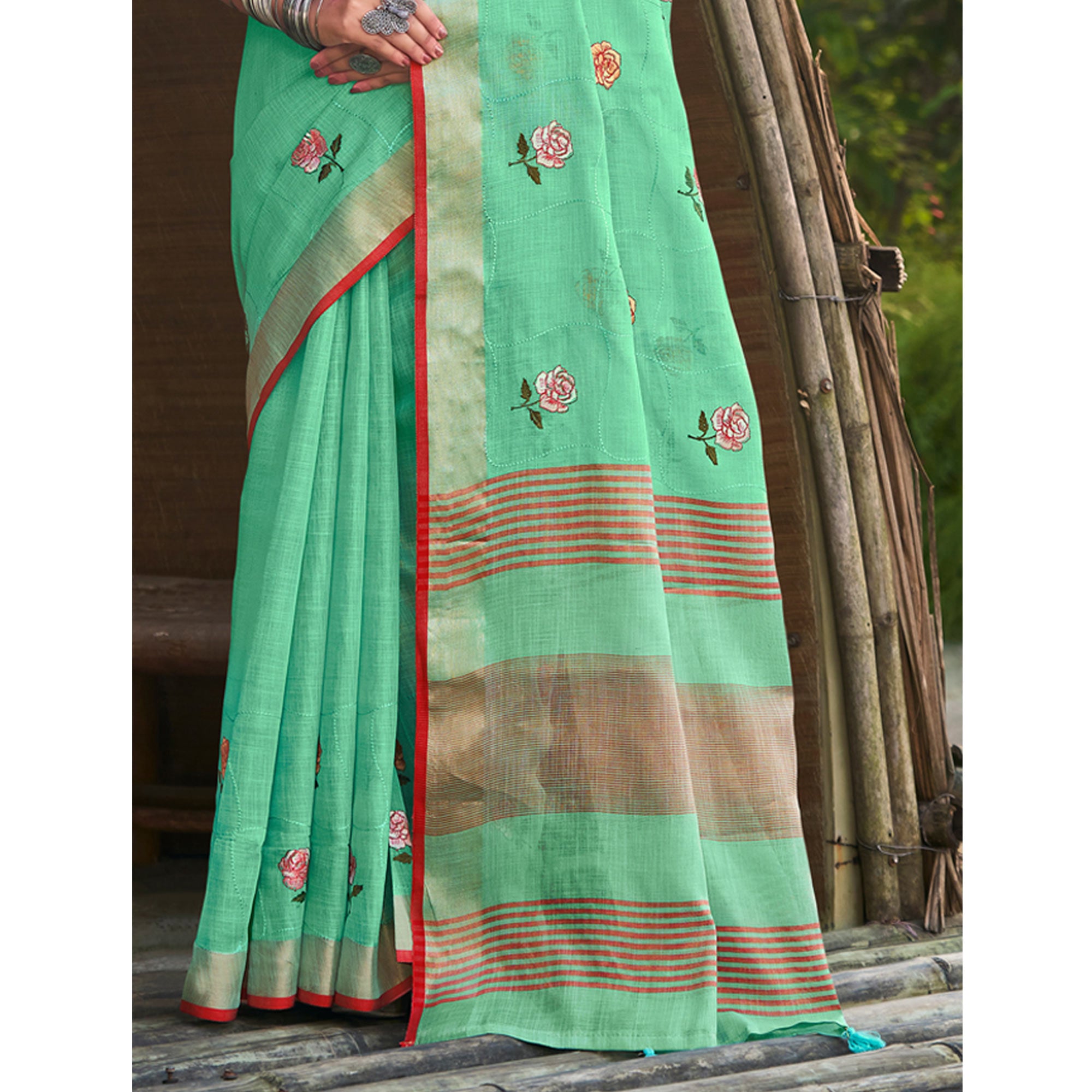 Sea Green Floral Embroidered Linen Saree With Tassels