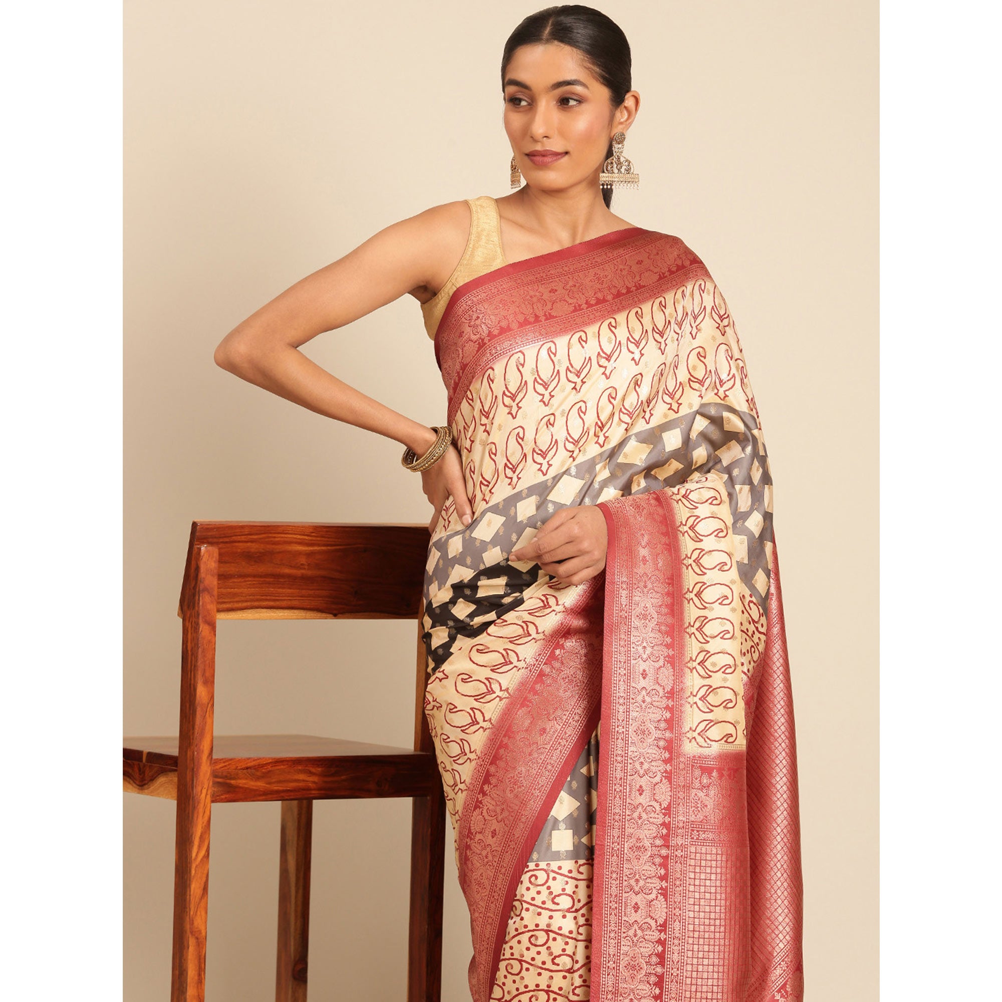 Cream Woven Banarasi Silk Saree With Tassels