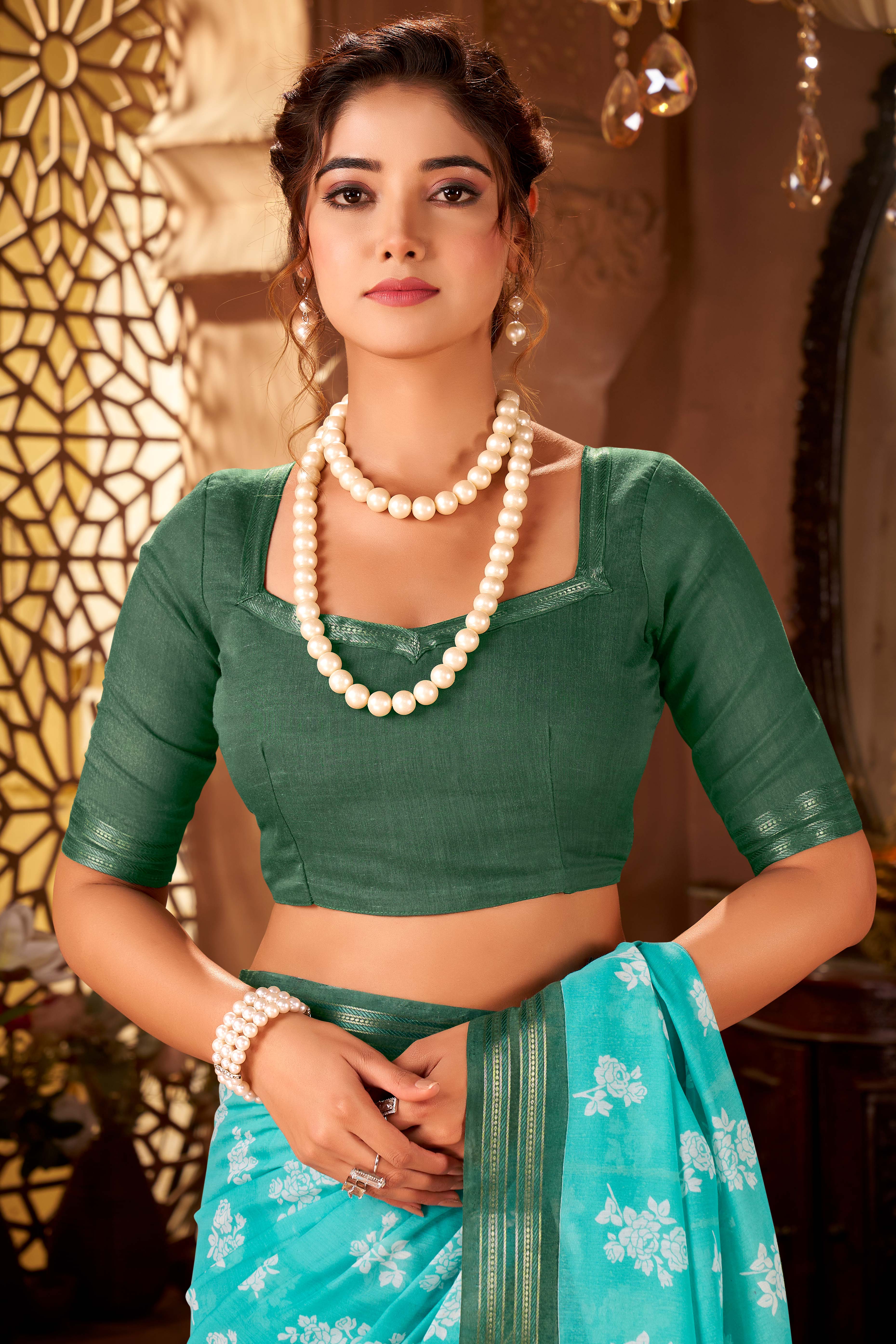 Sophisticated Turquoise Mulmul Cotton Saree Featuring Delicate Floral Prints & Weaving Border