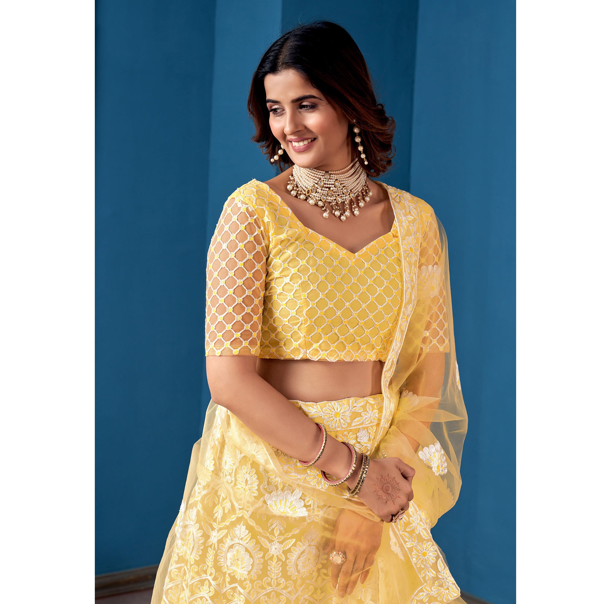 Yellow Floral Sequins Embroidered Net Lehenga Choli