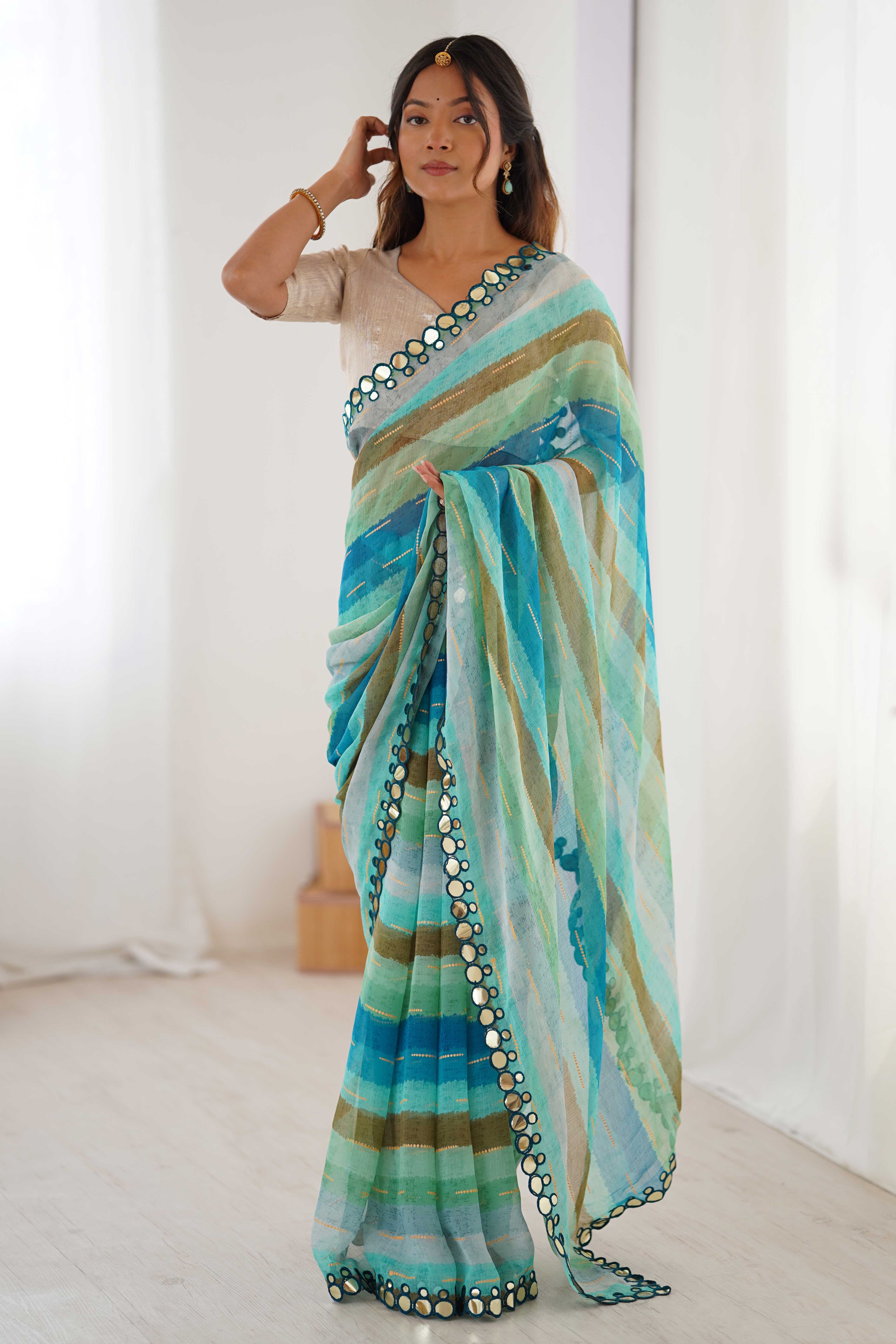 Soft Chiffon Turquoise Saree Featuring Classic Leheriya and Mirror Work Edges