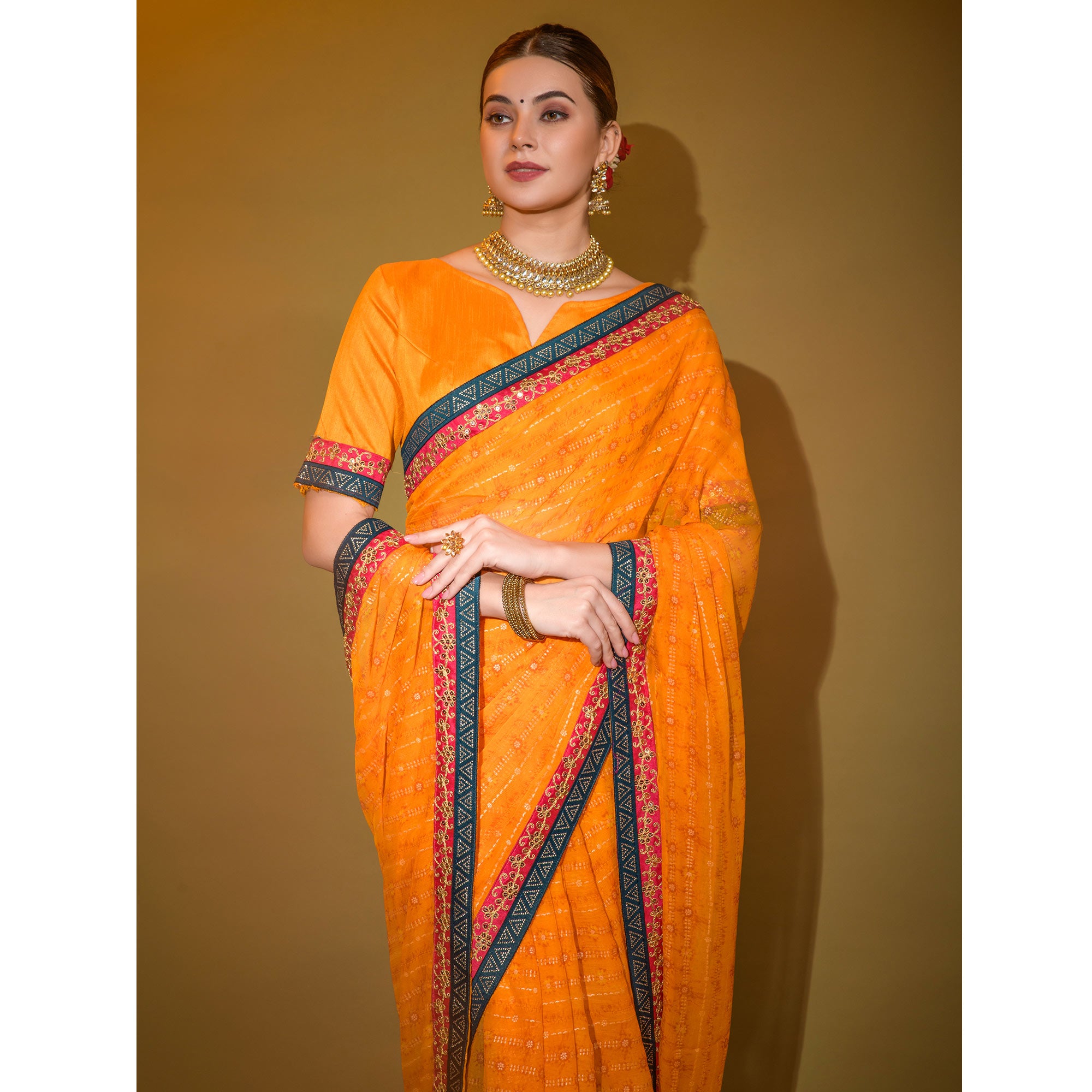 Orange Foil Printed Georgette Saree With Embroidered Border