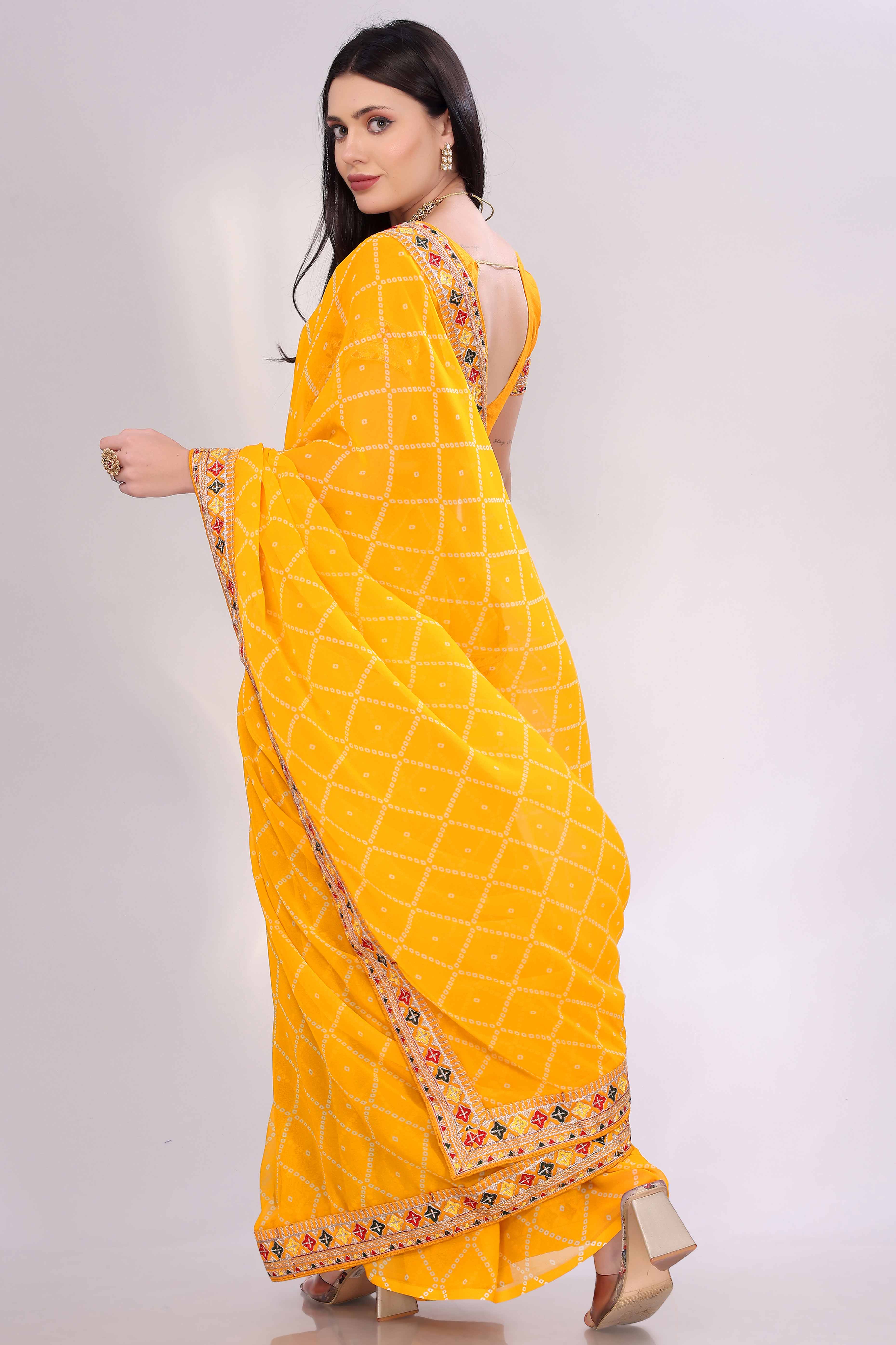 Yellow Bandhani Printed Georgette Saree Framed With Elegant Embroidered Border