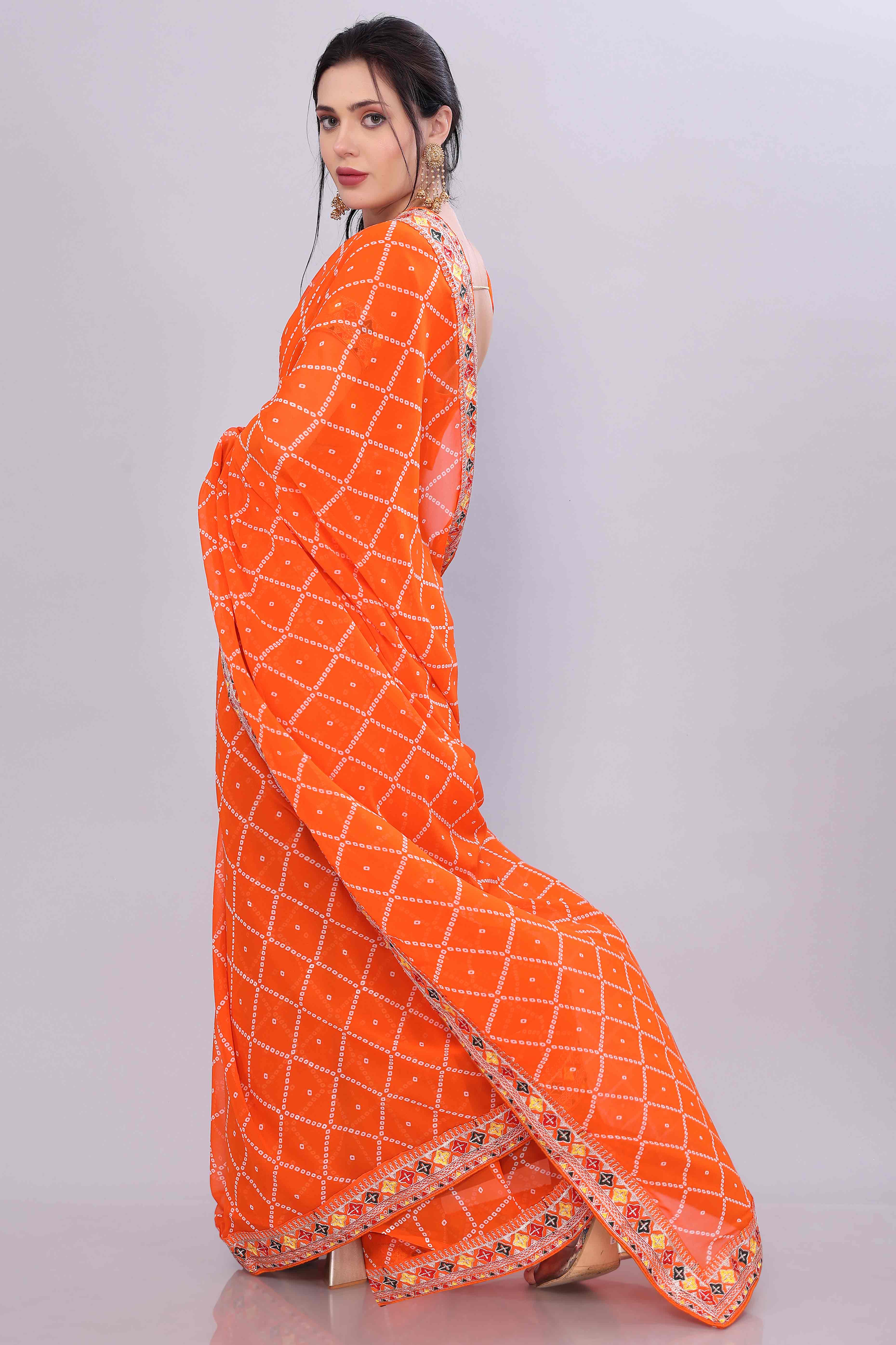 Orange Bandhani Printed Georgette Saree Framed With Elegant Embroidered Border