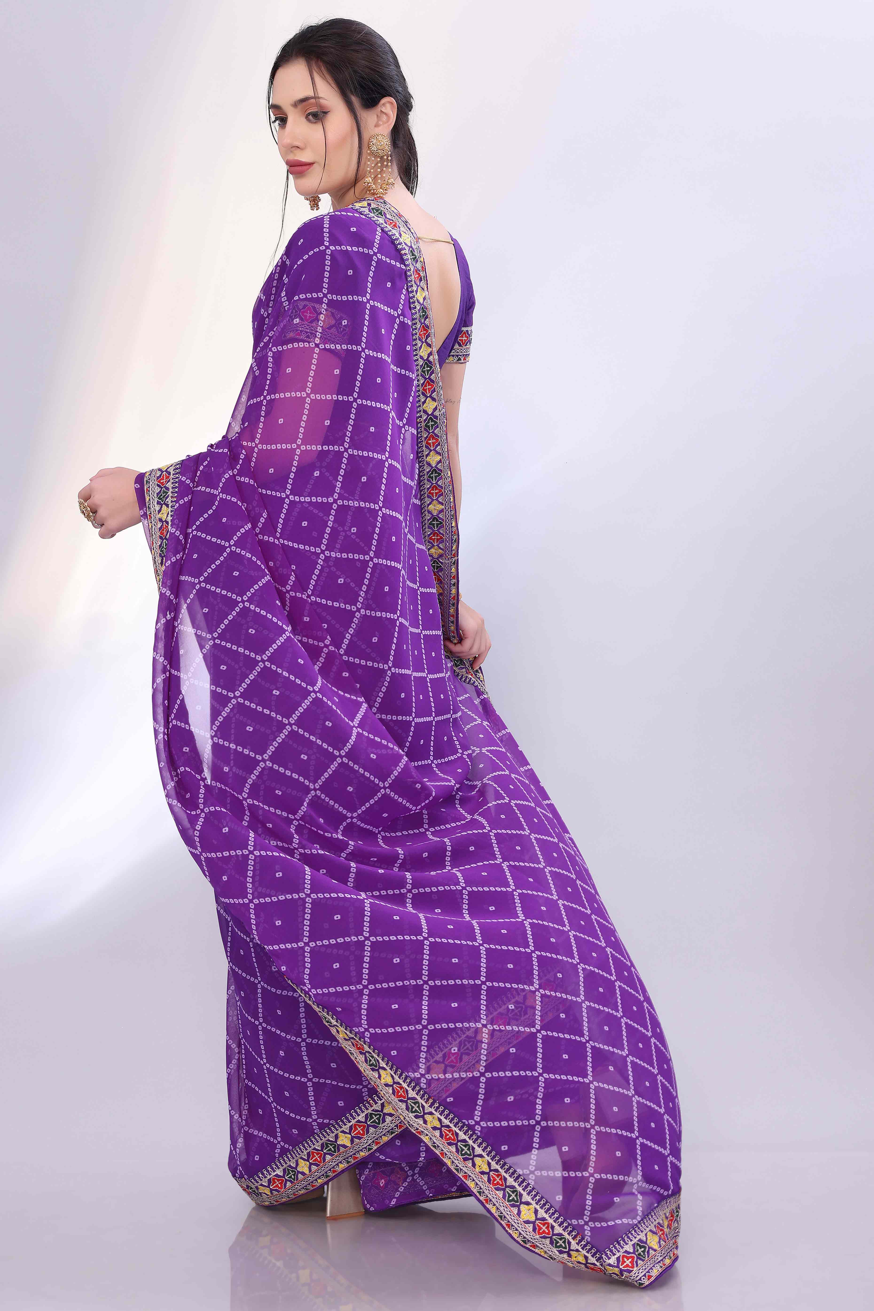 Purple Bandhani Printed Georgette Saree Framed With Elegant Embroidered Border