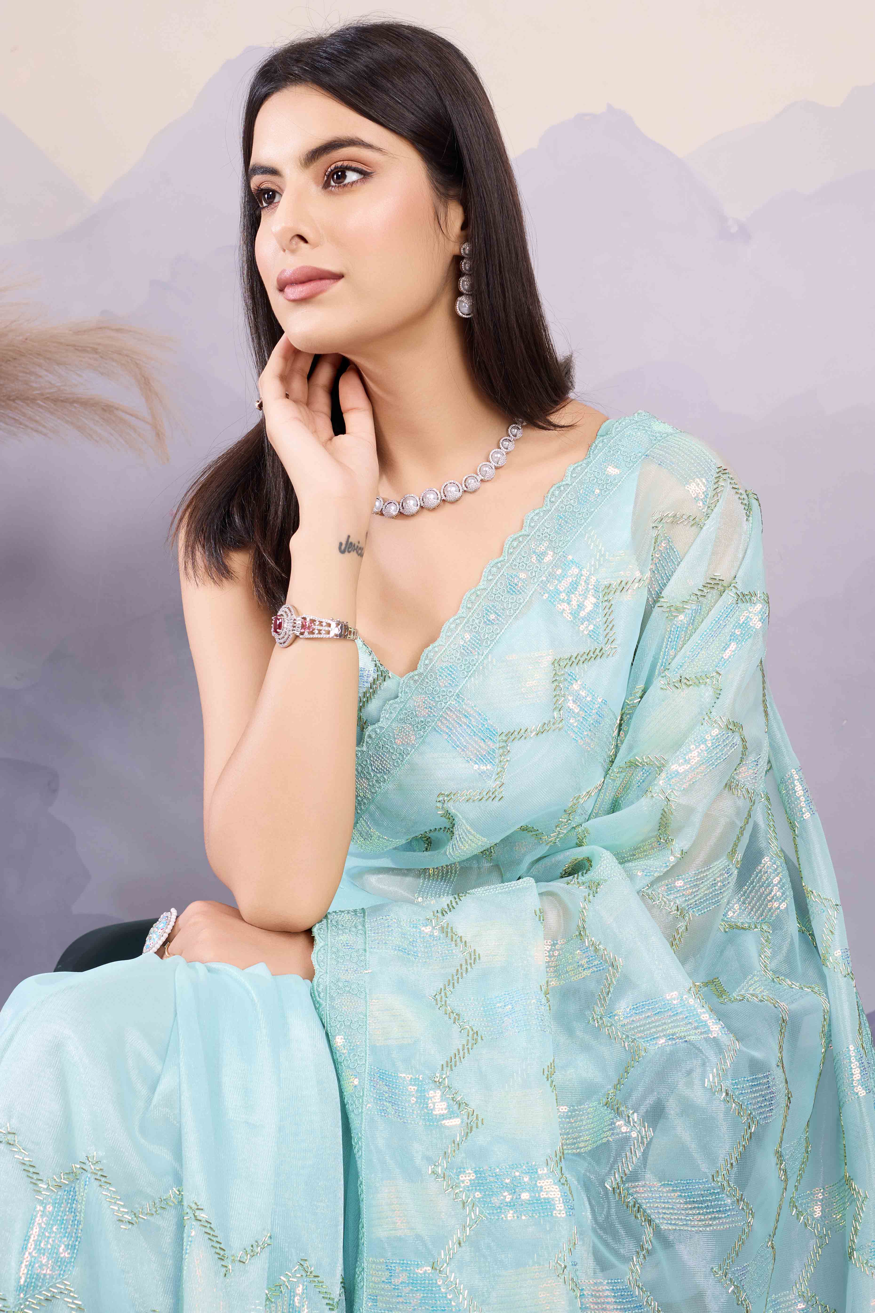 Light Turquoise Sequins Embroidered Twill Net Saree