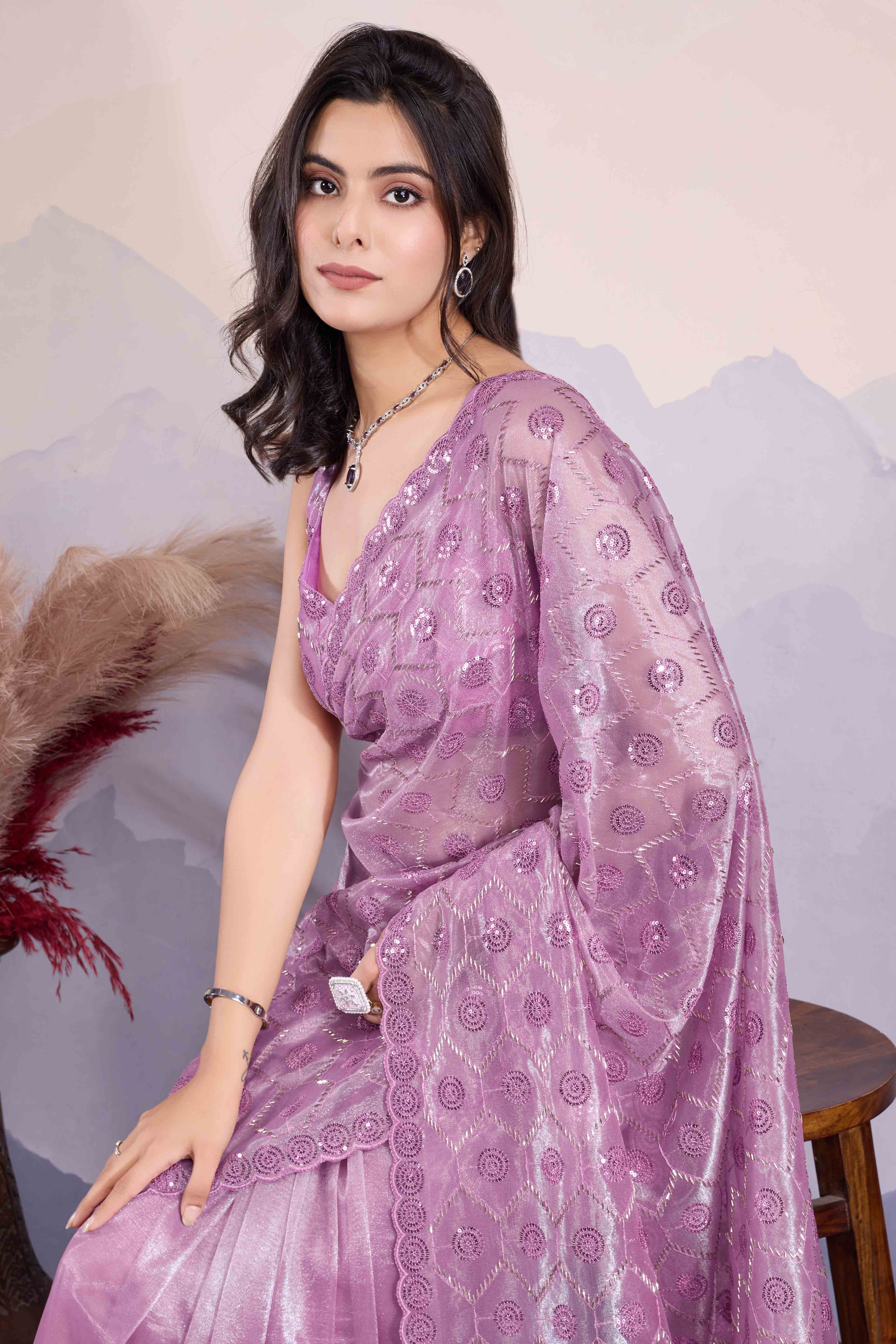 Mauve Sequins Embroidered Twill Net Saree