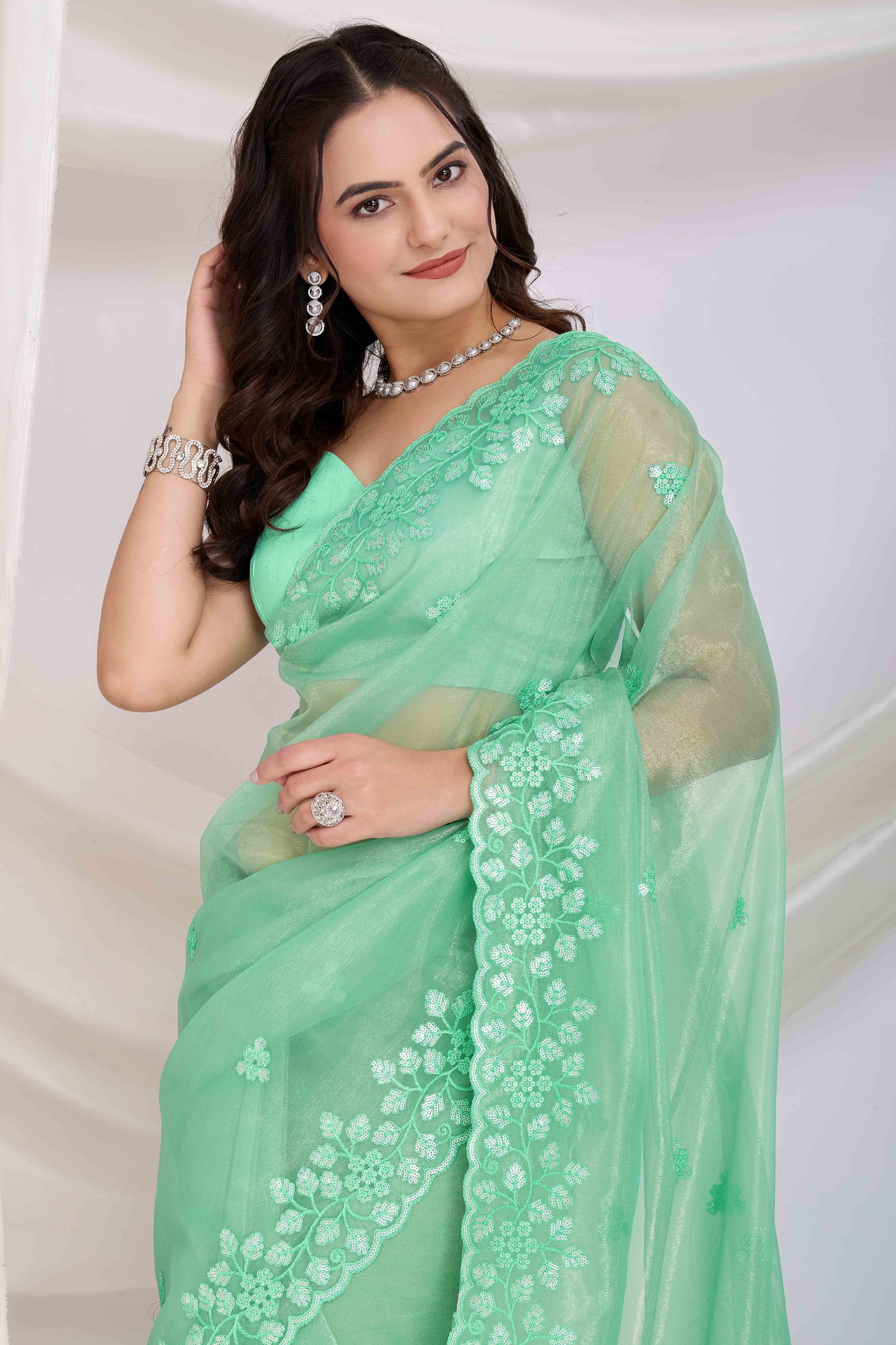 Sea Green Floral Sequins Embroidered Twill Net Saree