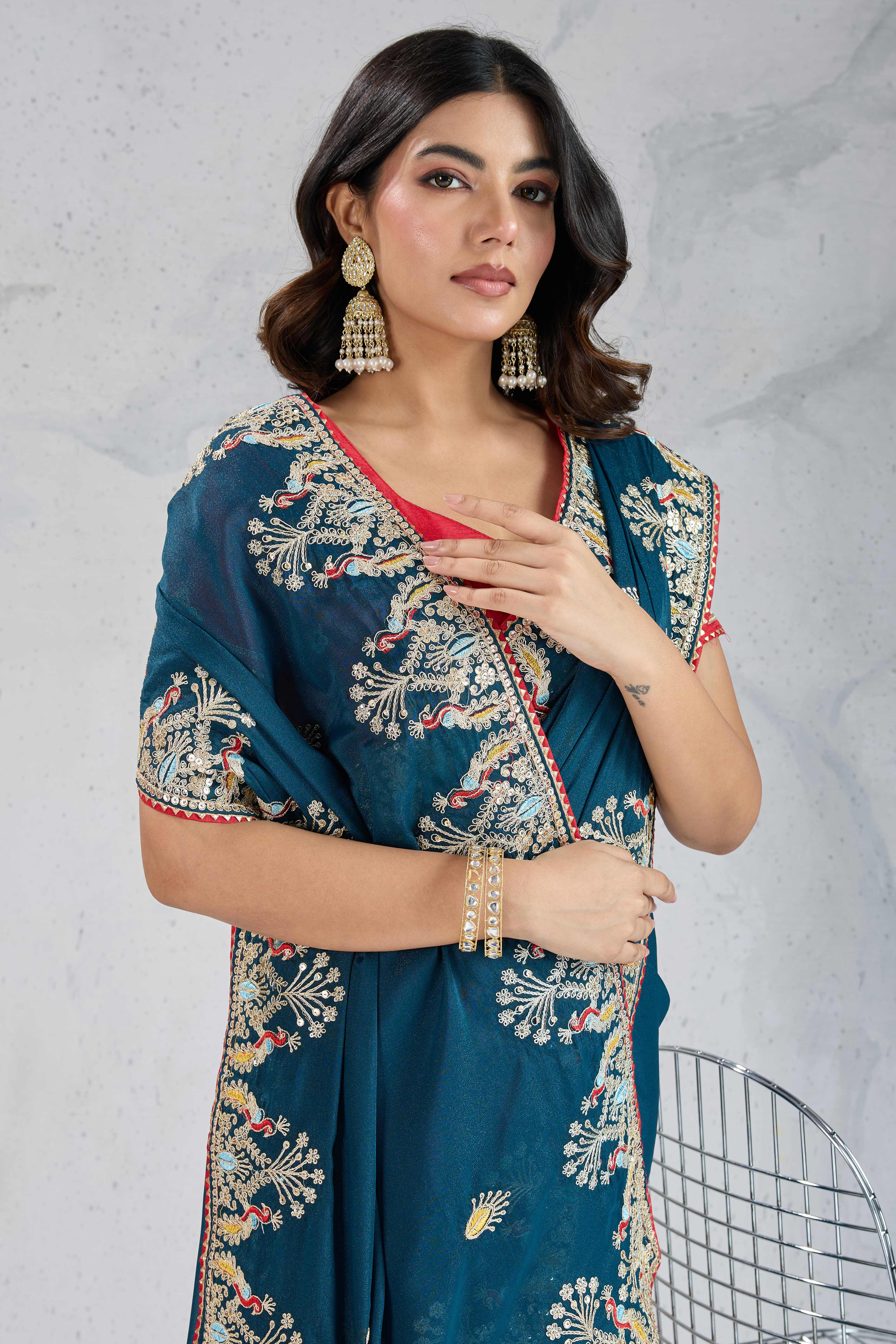 Teal Embroidered Saree with Ethnic Detailing in Georgette Fabric