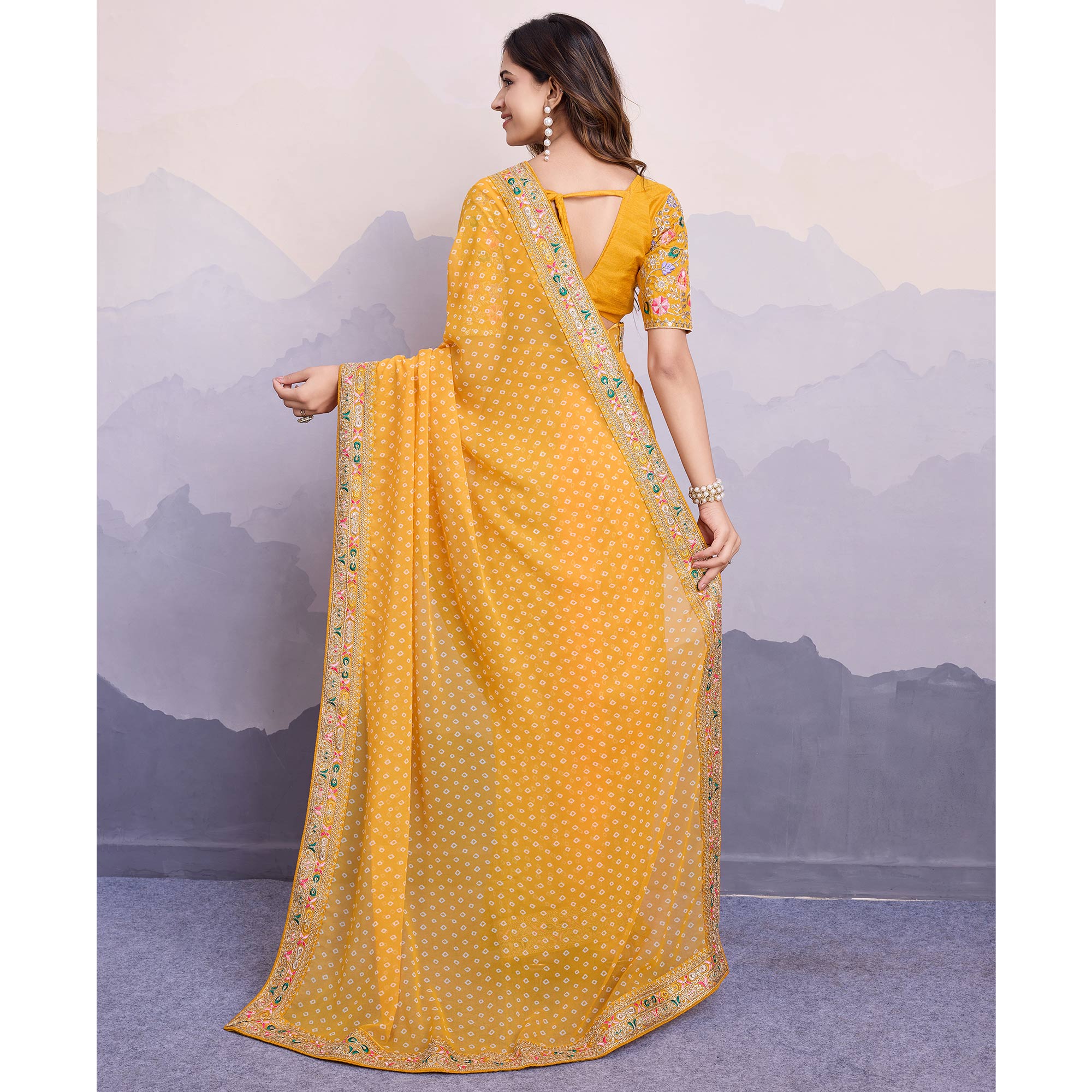 Yellow Bandhani Printed Georgette Saree With Embroidered Lace Border