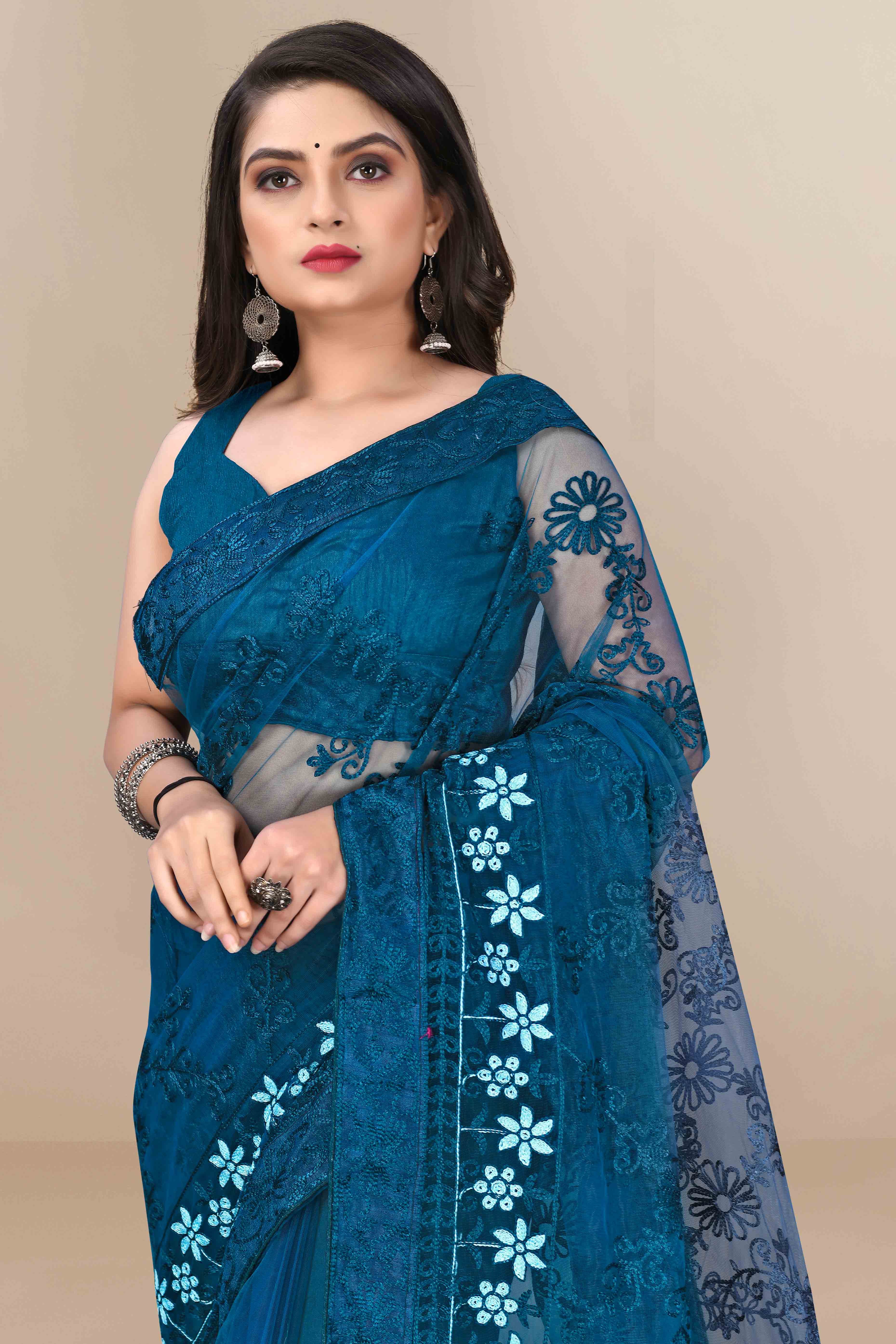 Teal Party Wear Net Saree Featuring Rich Floral Embroidery