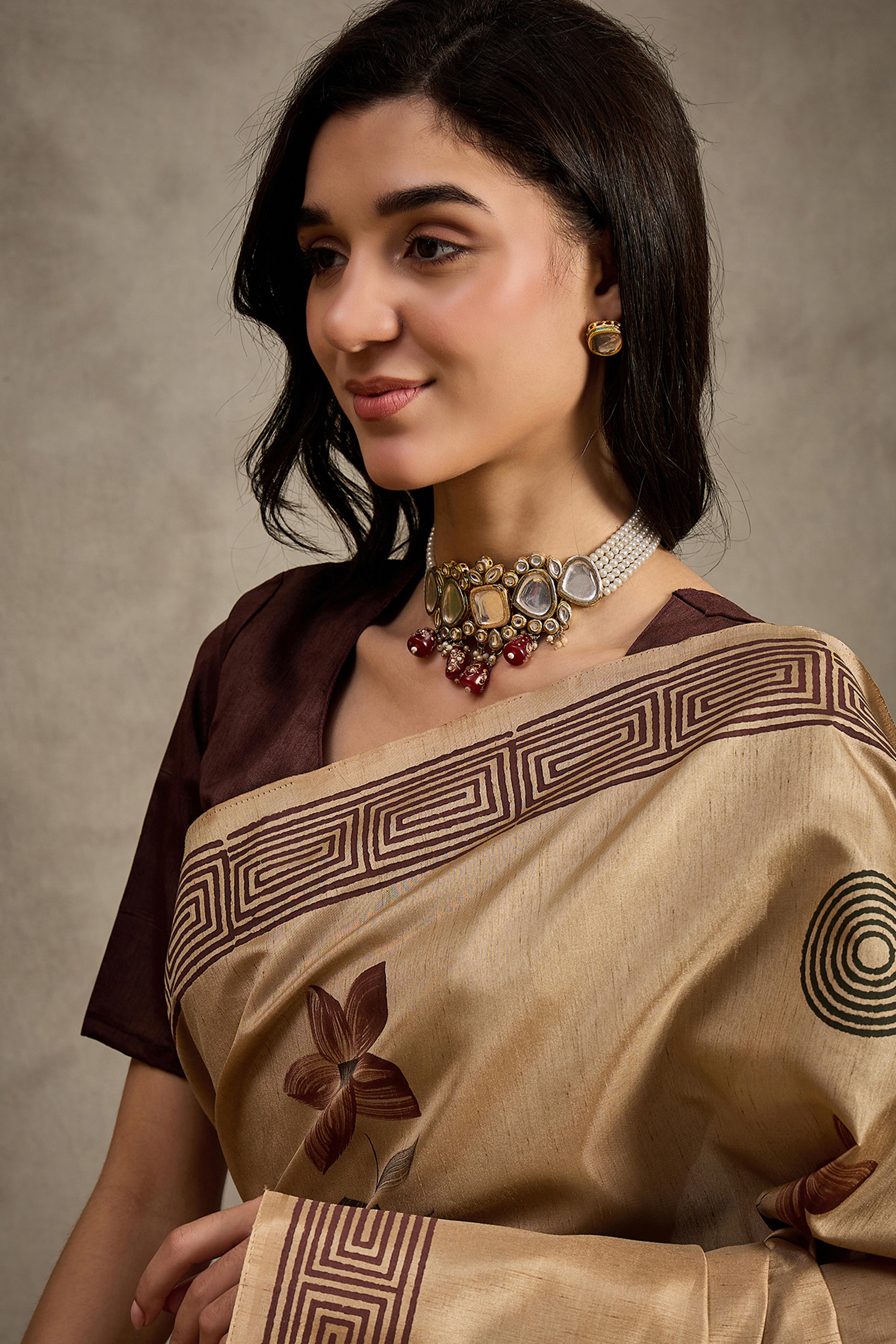 Refined Beige Floral Print Kozi Cotton Silk Saree Highlighted With Tassel Pallu