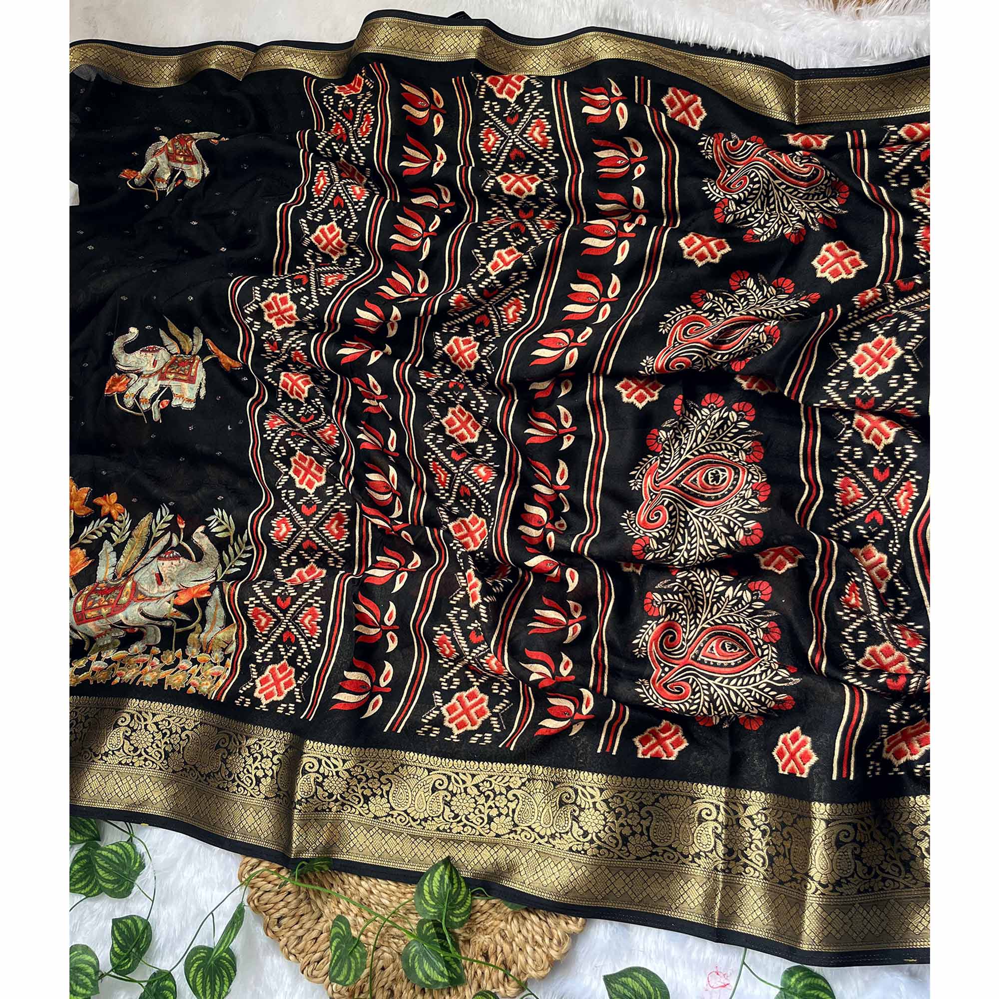 Elegant Black Elephant & Floral Printed Georgette Saree Accented With Gleaming Weaving Zari Border