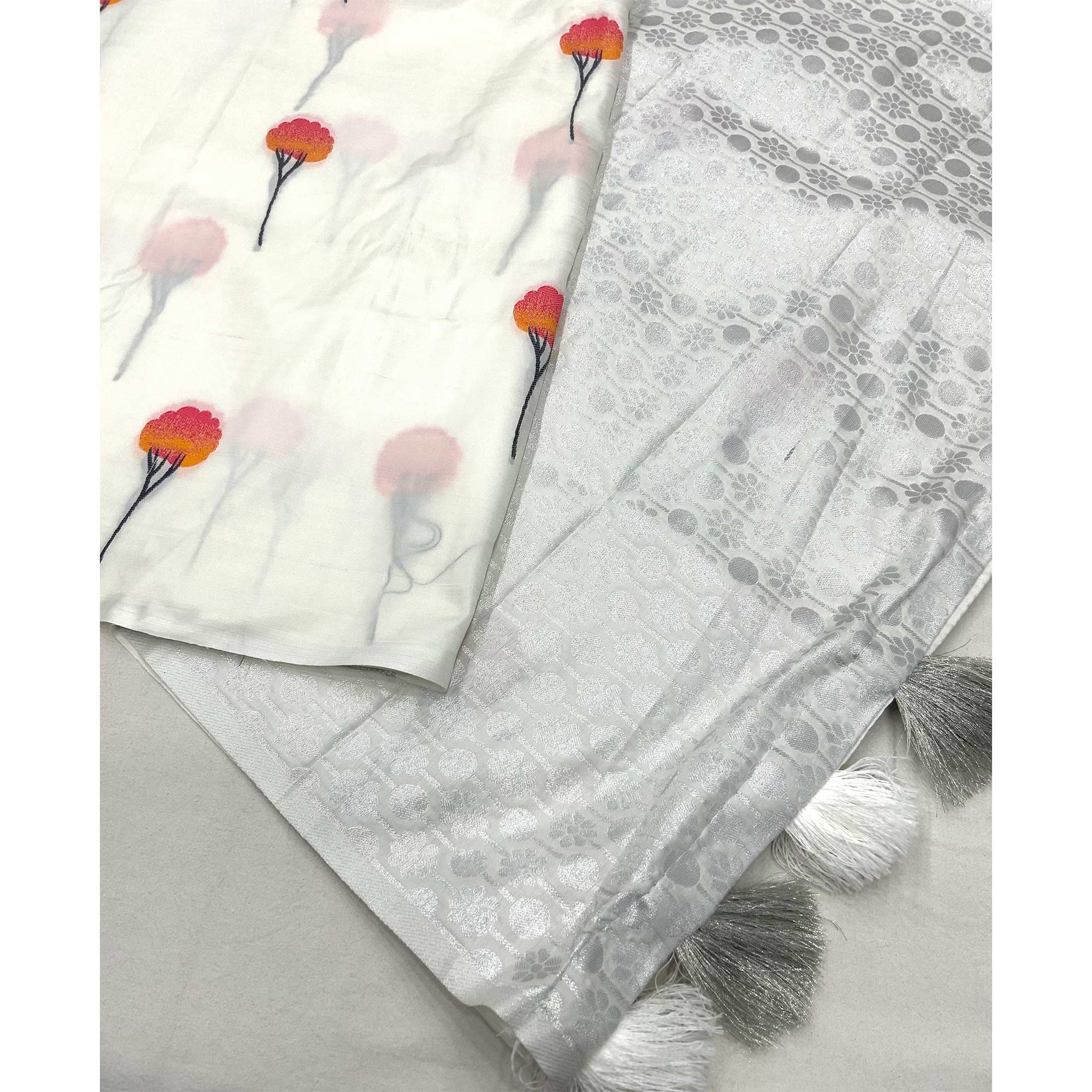 Elegant White Banarasi Silk Saree With Floral Zari Weaving & Tassel Border