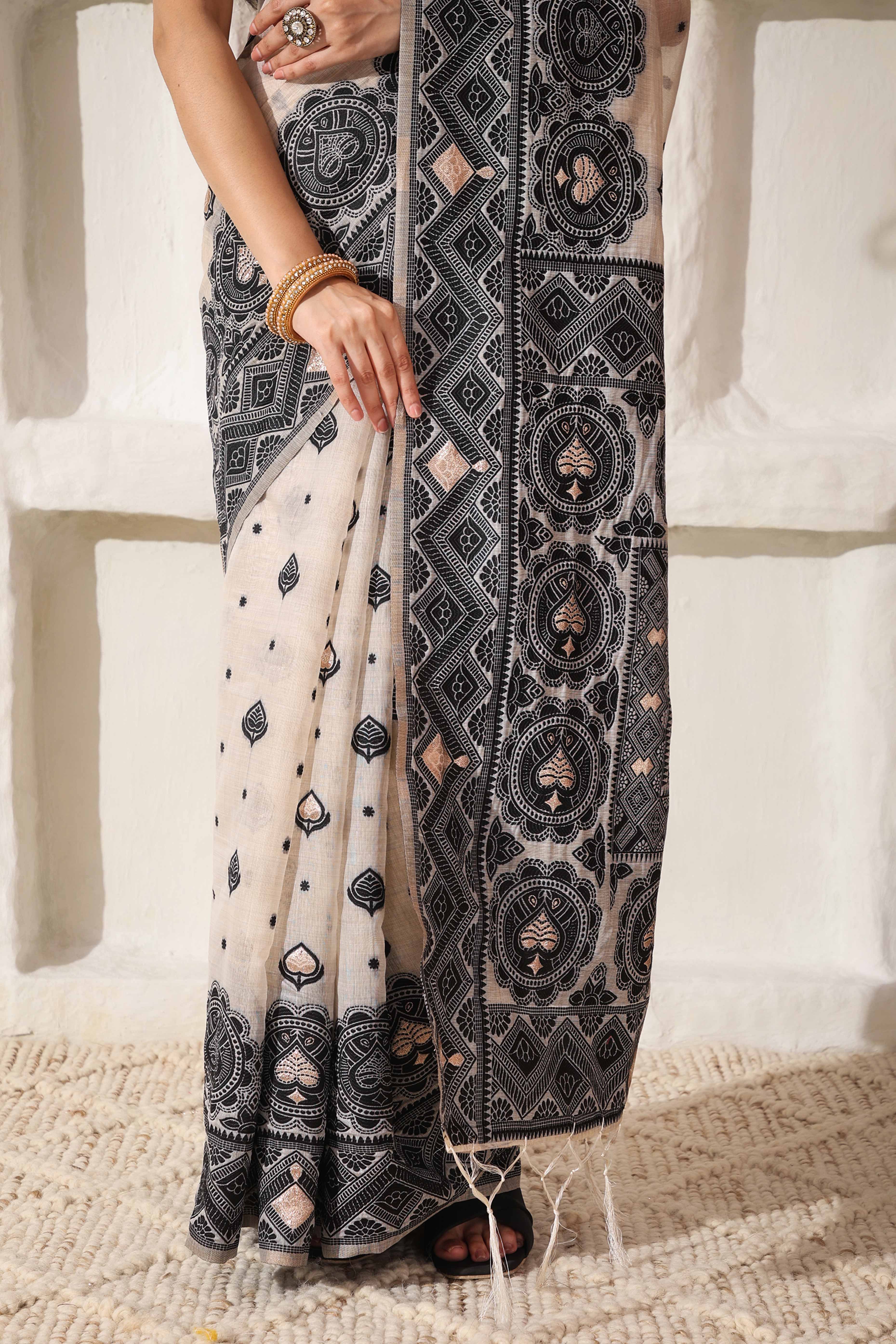 Timeless Cream & Black Saree In Linen Cotton With Rich Zari Weaving And Tassel Pallu