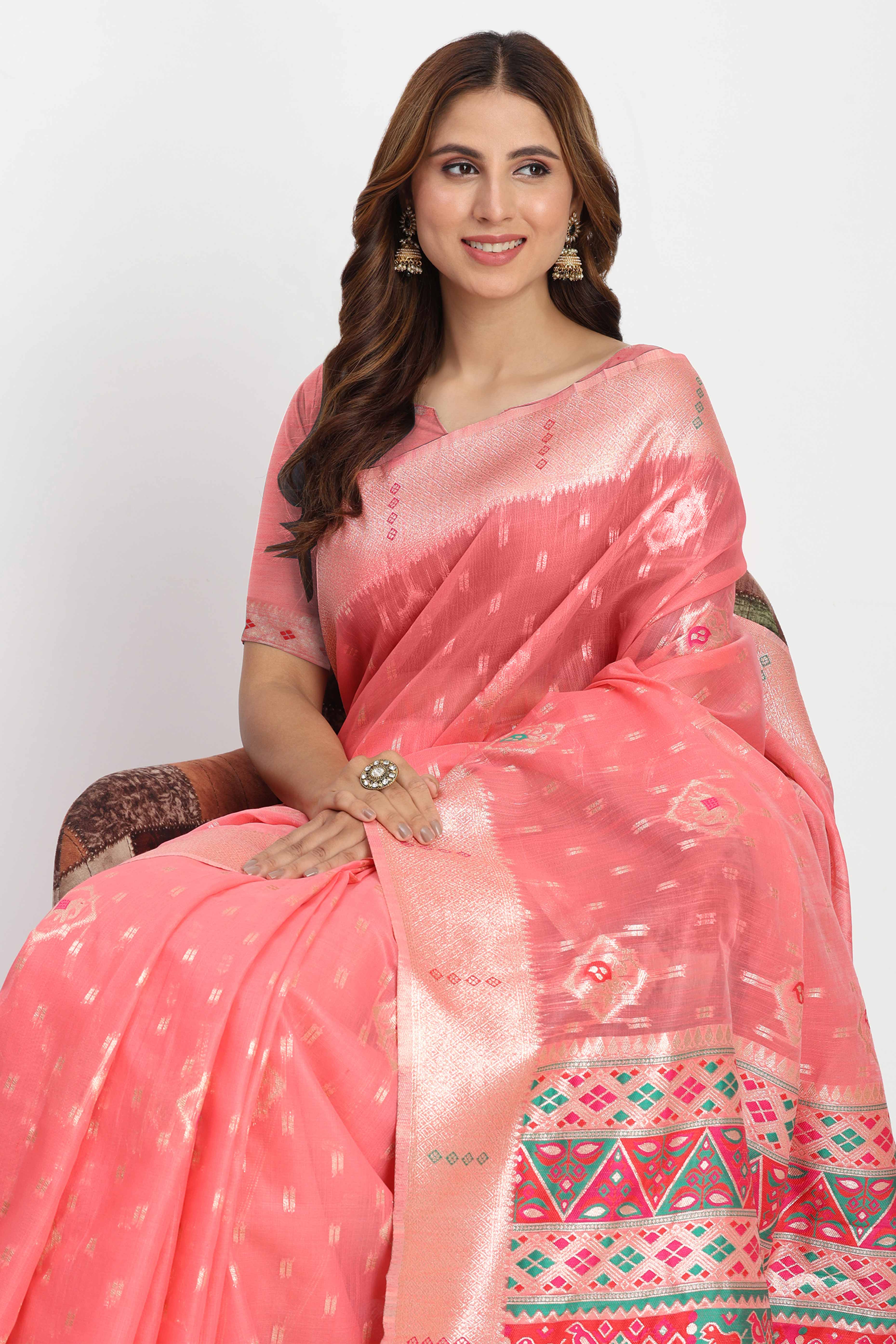 Shimmering Coral Pink  linen Cotton Saree Embellished With Rich Zari Weaving And Tassels Pallu