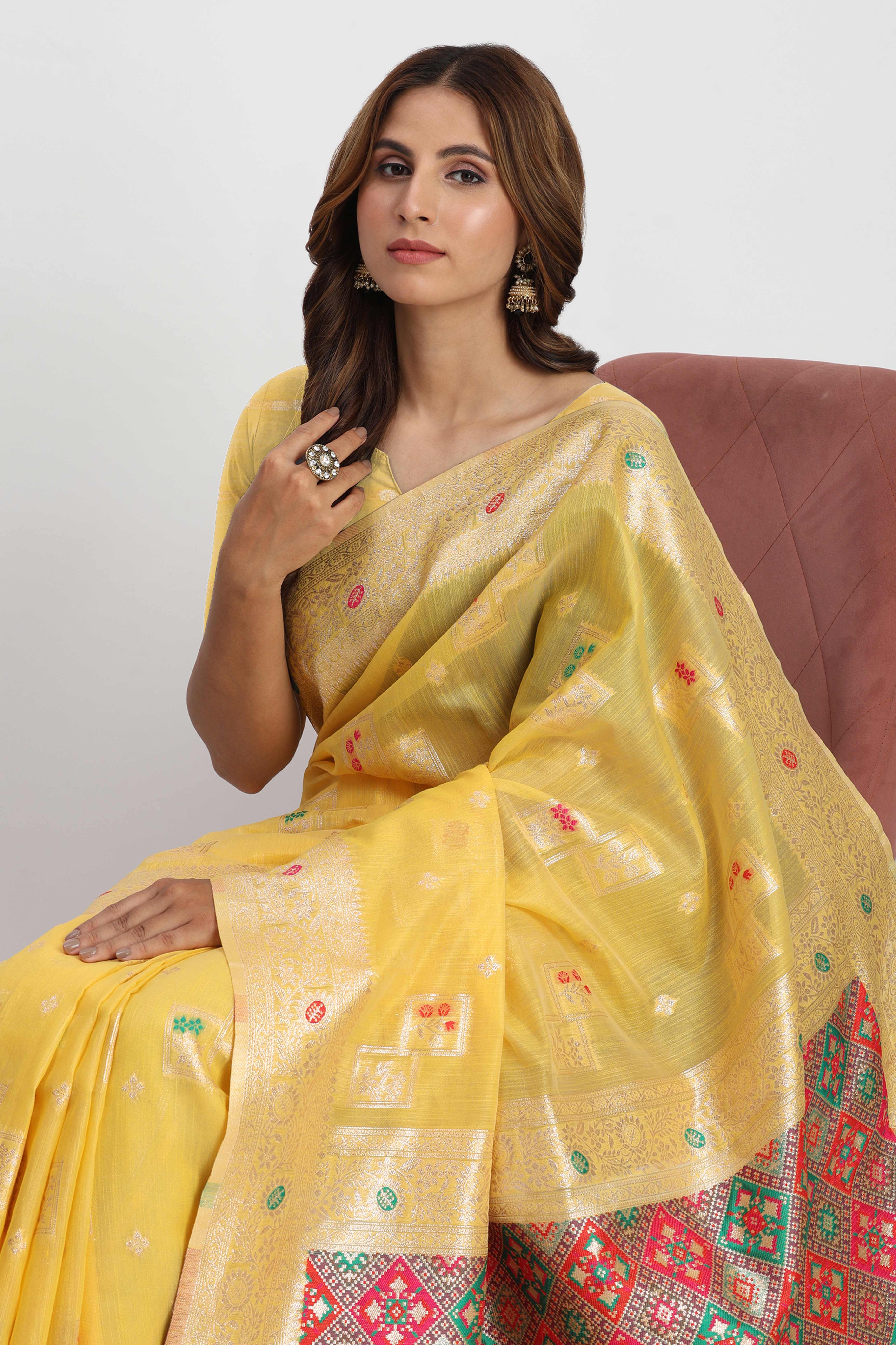Floral Zari Weaving Brings Regal Beauty To This Yellow Linen Cotton Saree With Tassel Accents