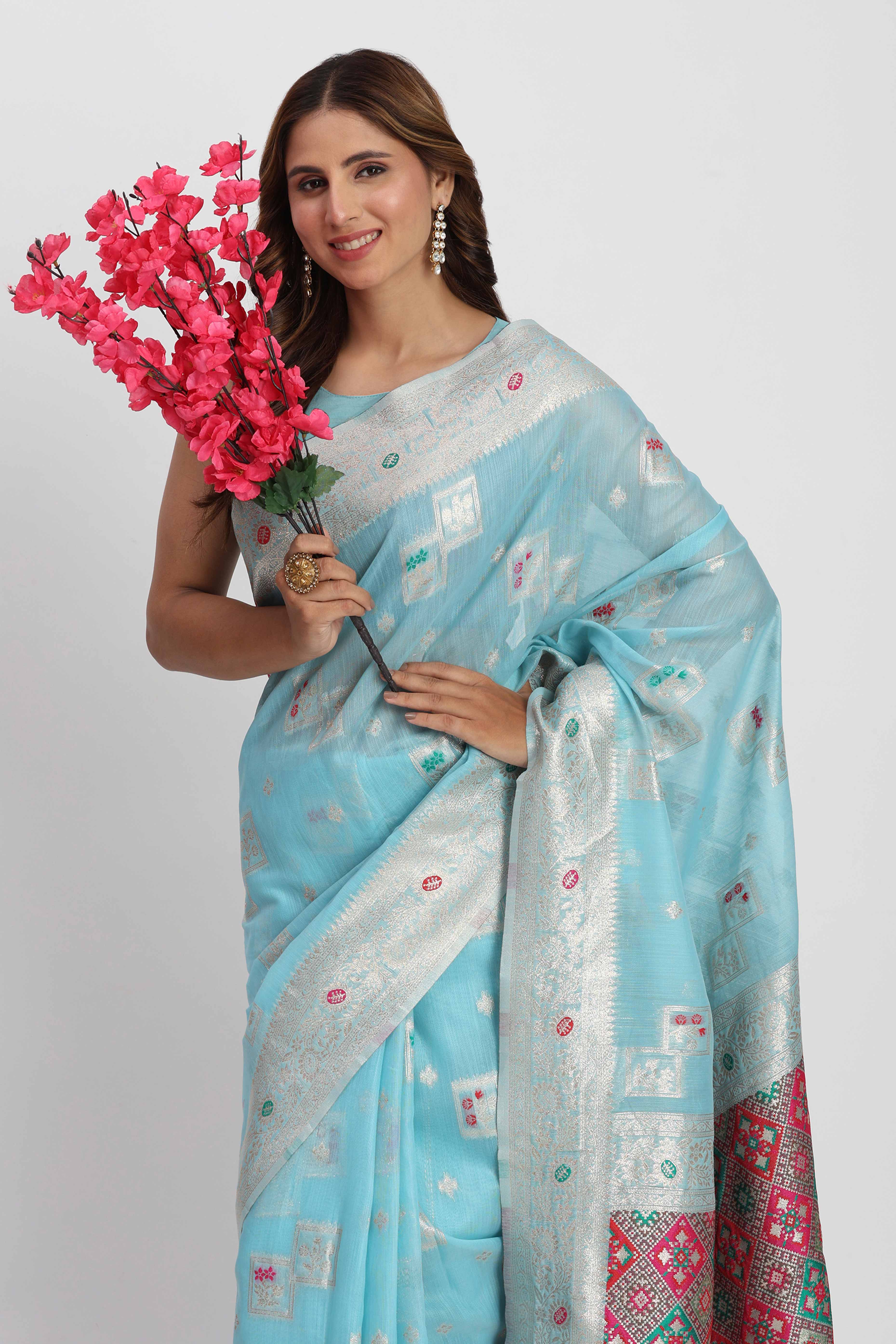 Floral Zari Weaving Brings Regal Beauty To This Sky Blue Linen Cotton Saree With Tassel Accents