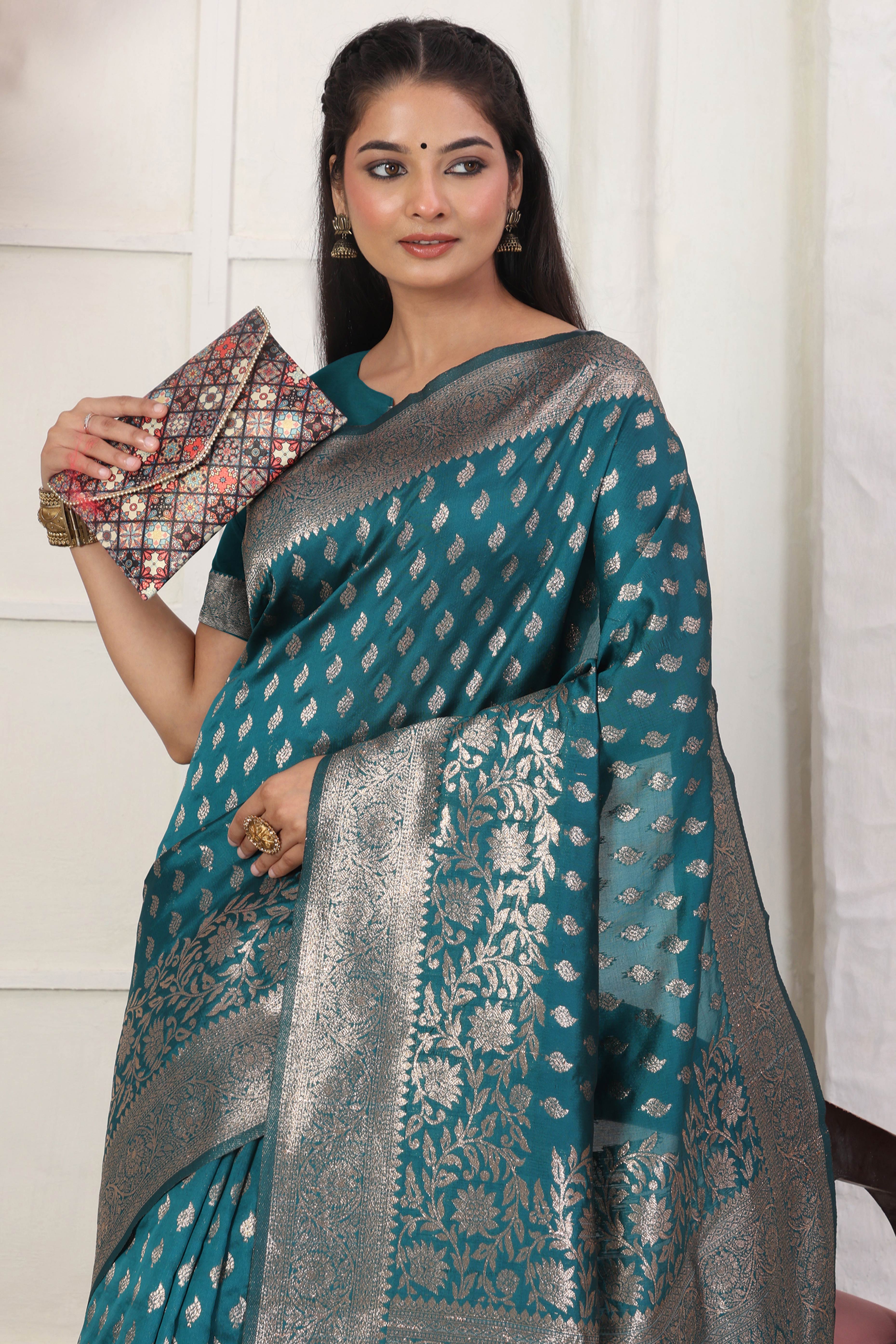 Rama Blue Traditional Lichi Silk Blend Saree Enhanced With Floral Zari Weaving & Tassel Pallu