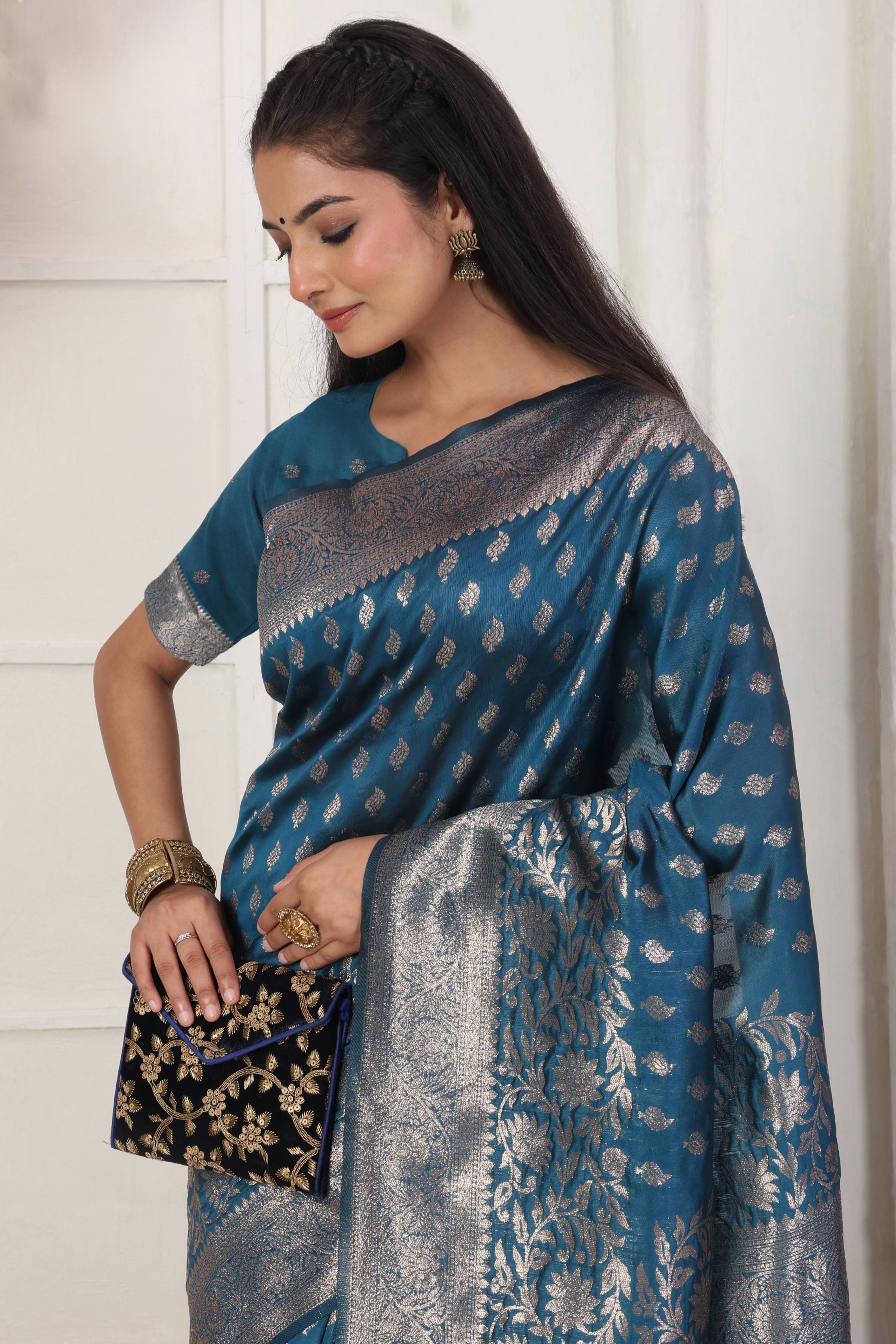 Blue Traditional Lichi Silk Blend Saree Enhanced With Floral Zari Weaving & Tassel Pallu